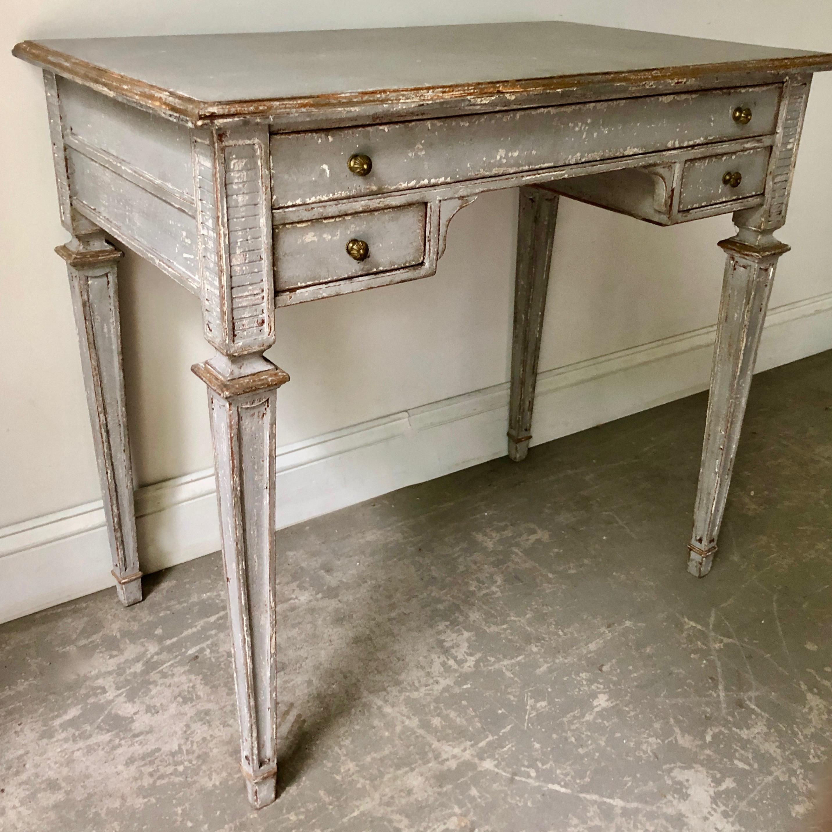 Charming small 19th century French Louis XVI style Bureaux plat with drawers with carved tapered legs.
 