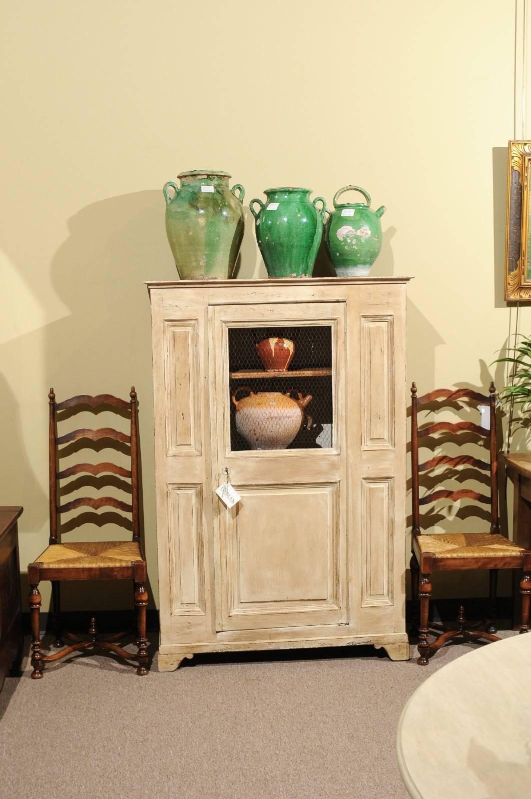 19th century painted cabinet from France.

This charming small cabinet would be ideal for use in a kitchen, bathroom or a child's room. In spite of its small size, it provides ample storage for any number of things without taking up too much room.