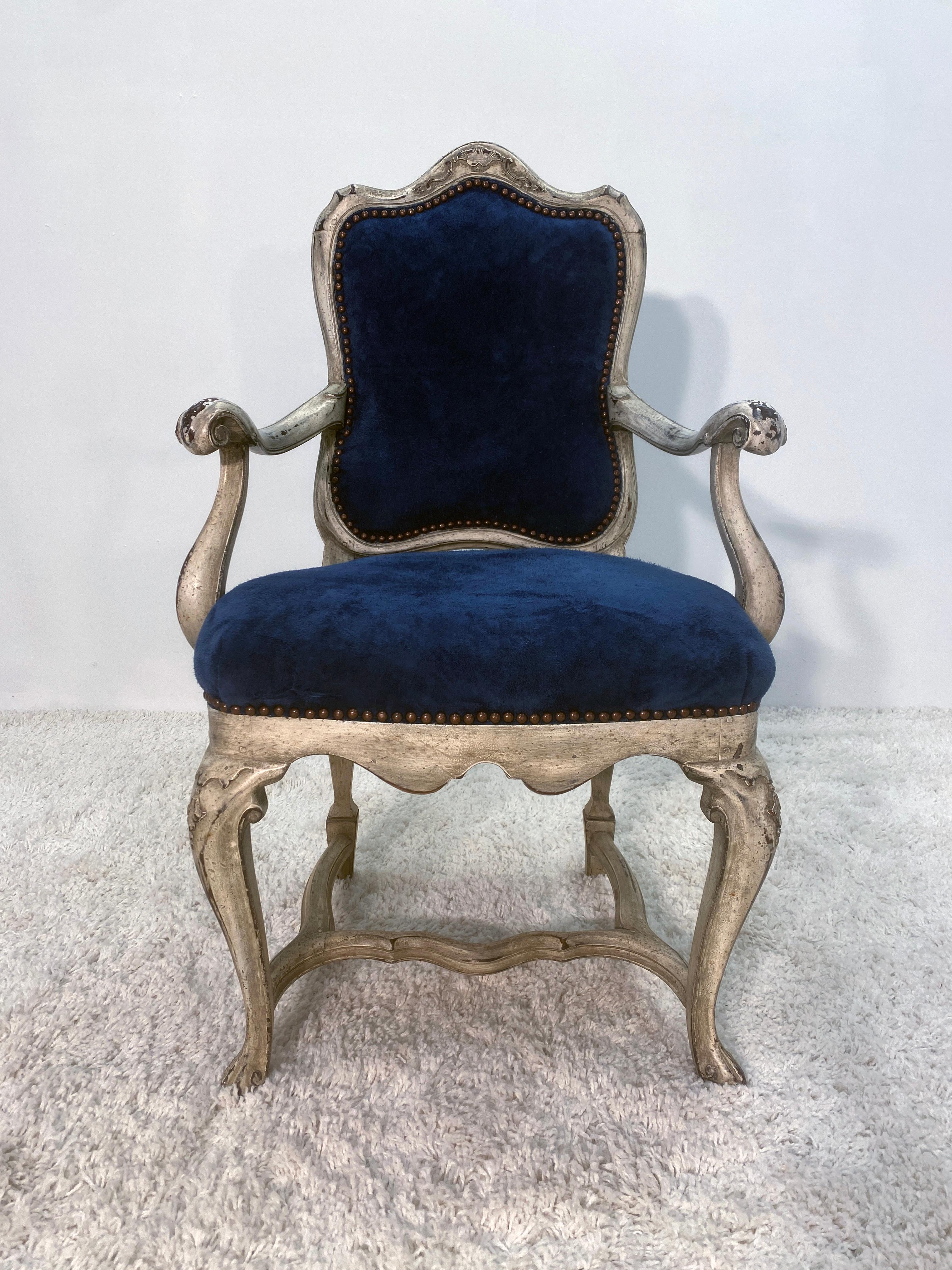 Very solid chair, this one shows good patina in the paint surface. The lacquer and glazing are warmly toned from age. No structural damage to the arms or legs. This is over all a very solid chair with no previous repair work.. We put new genuine