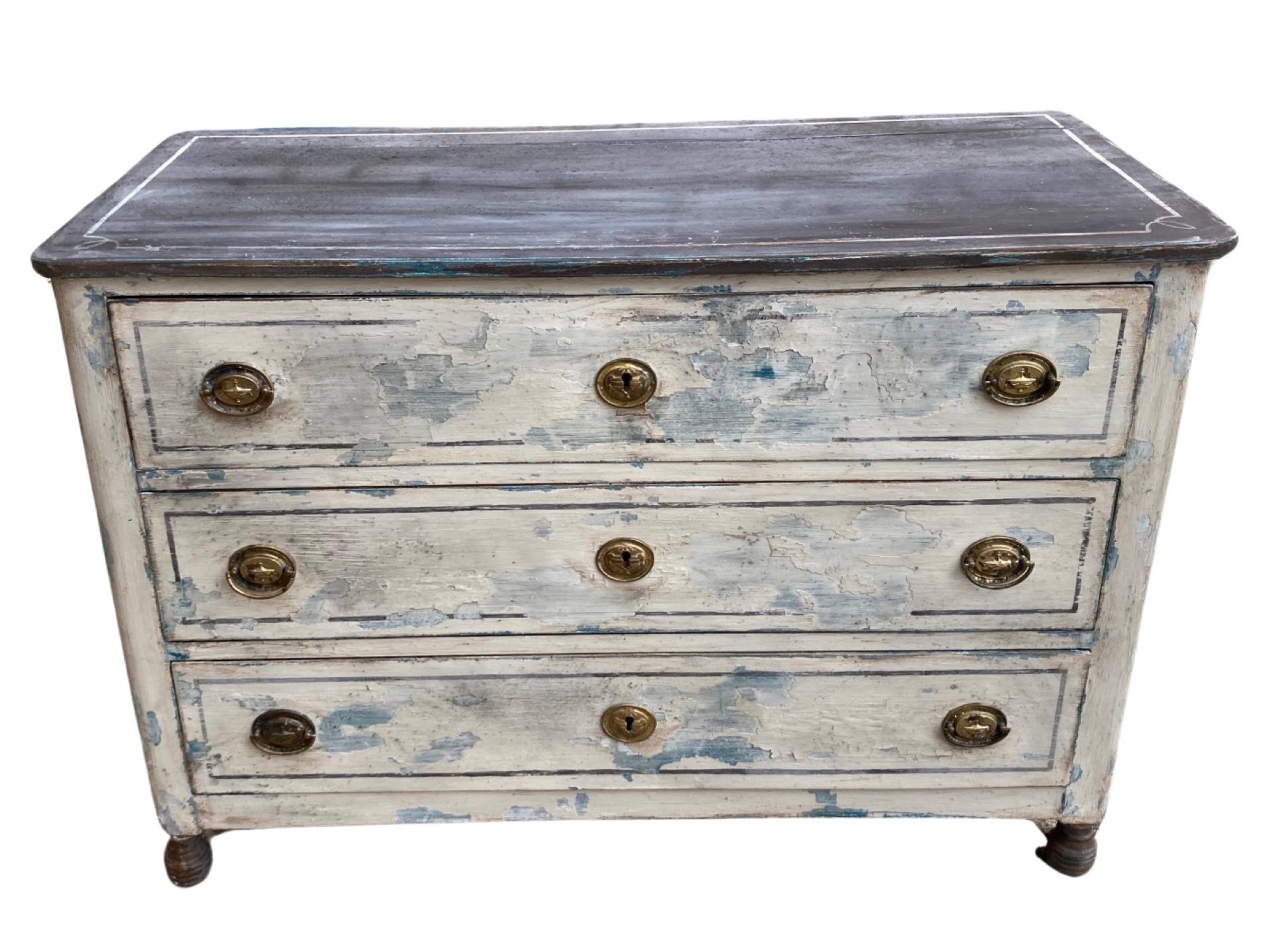 Commode handmade in Italy in the mid 1900 using walnut. The commode has a beautiful painted patina that givess it a very unique look, however, the paint is not original to the piece. The commode features three very large inset drawers of about the
