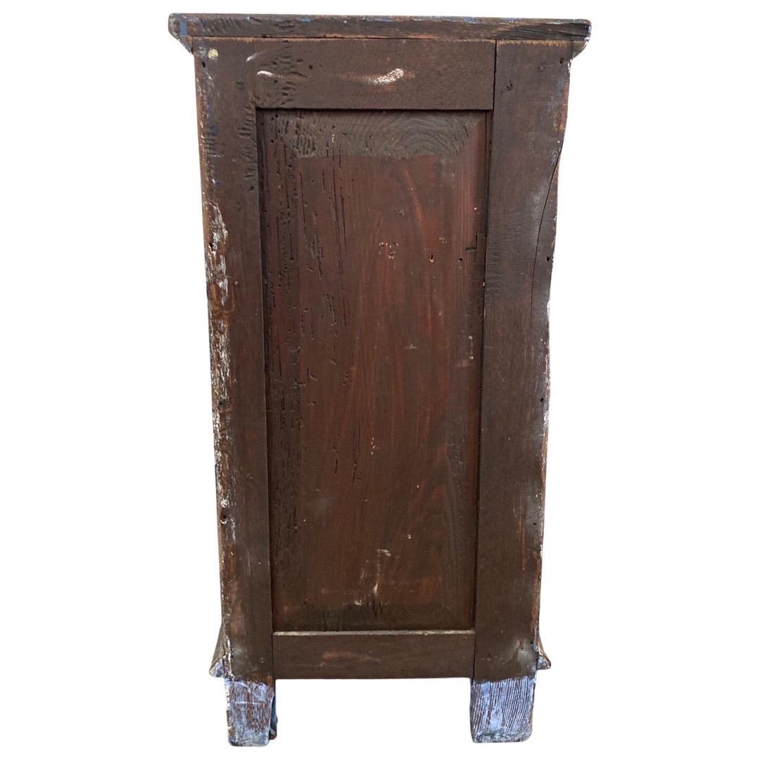 Small and tall night stand with drawers made in Italy in the early 1800s using oak. The small chest of drawers has been painted a light blue with darker blue highlights on the molding, feet and top. The overall appearance is that of a simple, yet