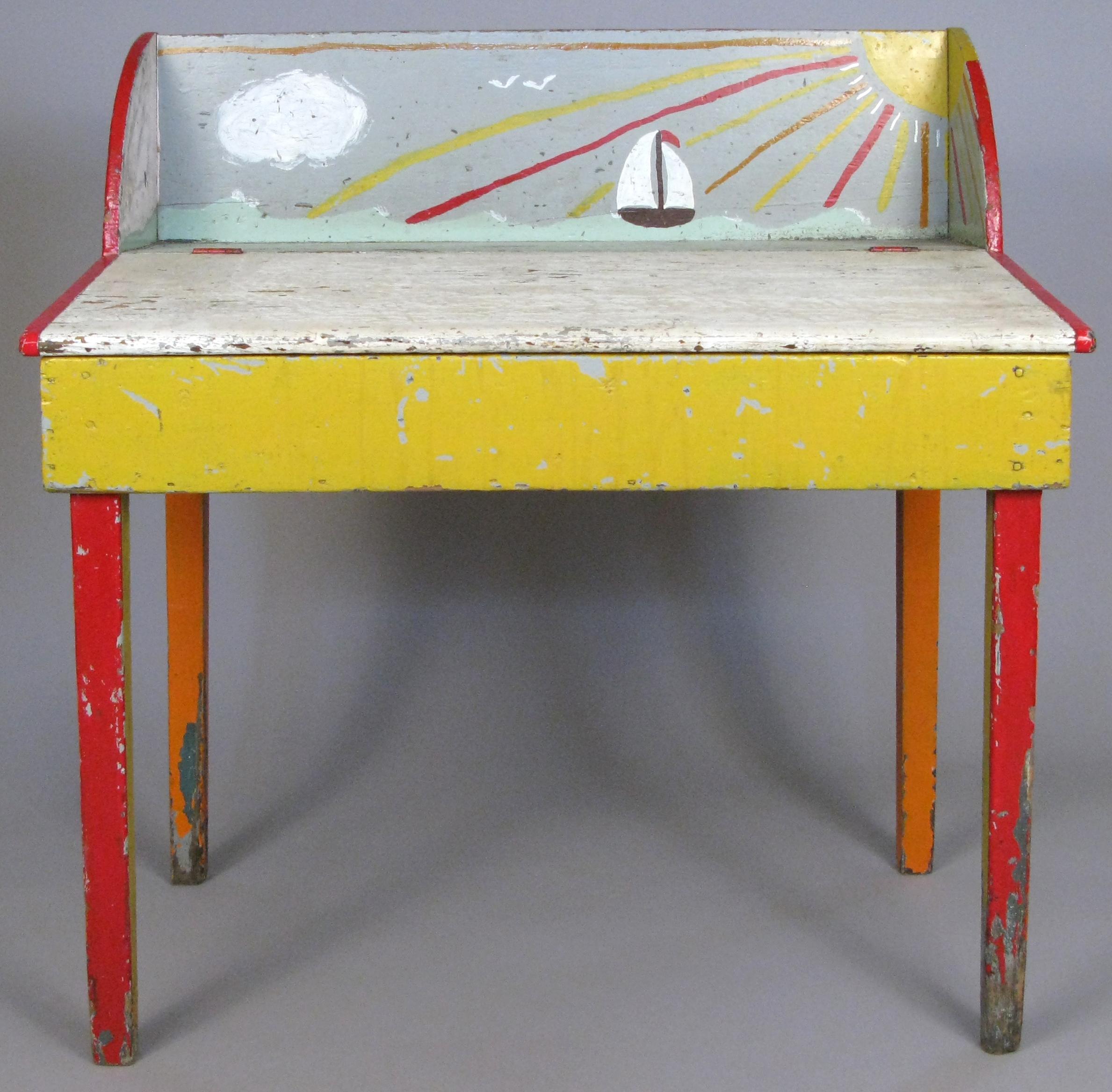 A very charming antique 19th century slant front pine desk found in Cape Cod, MA. Entirely hand painted in colors of red, yellow, orange, and white, with a whimsical ocean scene of a sailboat and the sun. Has a hinged work surface.