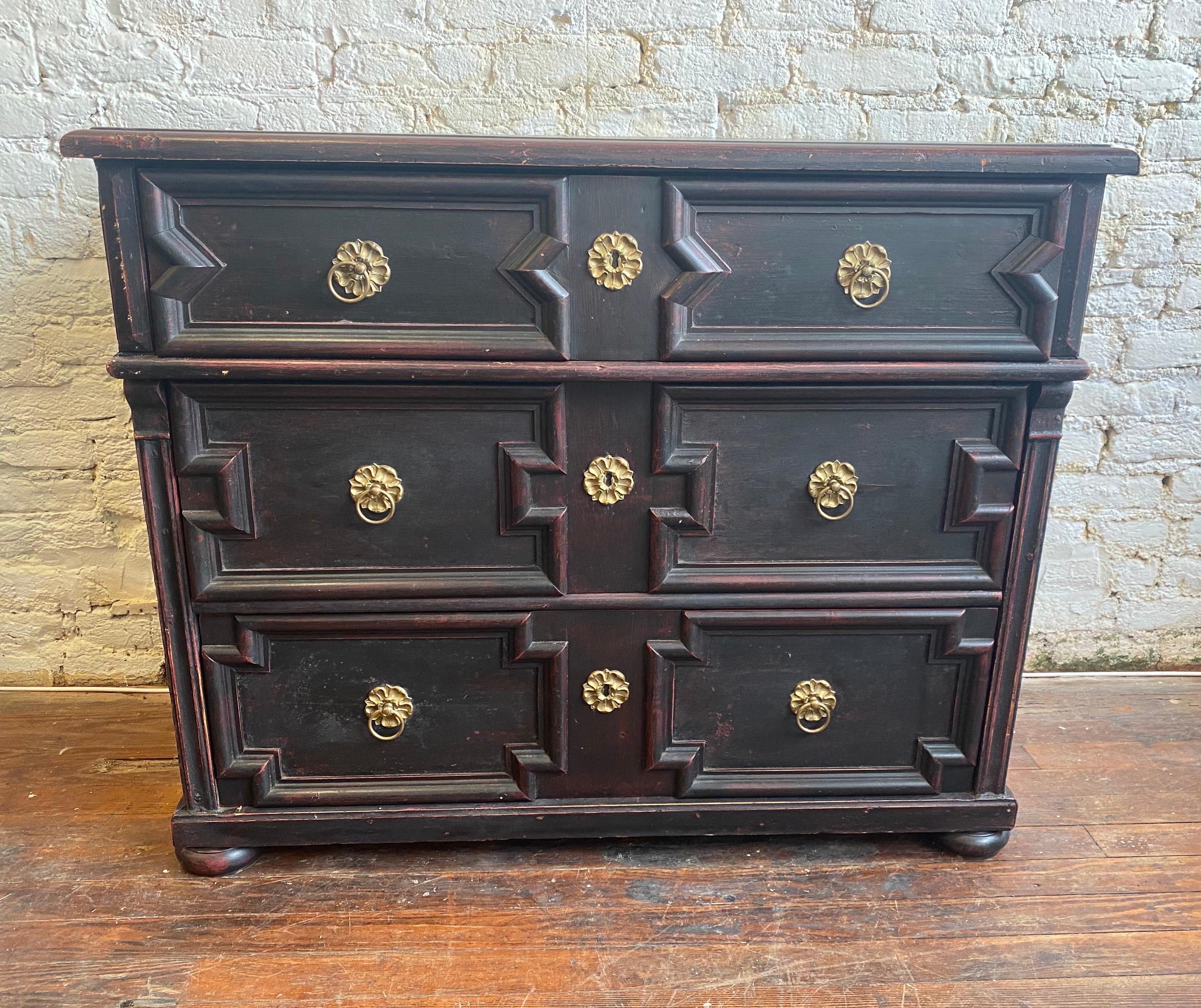 19th century painted pine German chest with black over red colored paint.