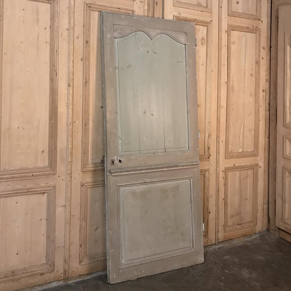 19th century painted pine interior door is the perfect choice to add a special touch to your favorite room! Gracefully tailored lines surround the raised panels with an archer's bow crown above and square panel below, divided by a chair rail molding