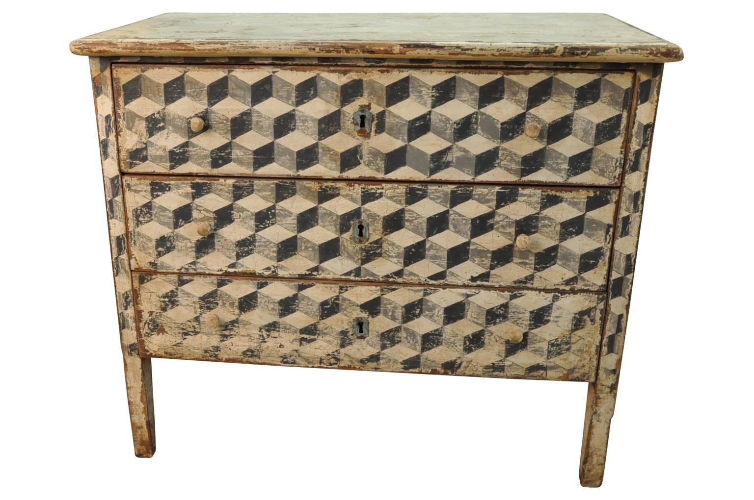 A sensational late 19th century painted commode from Spain. Great construction with three drawers and tapered legs. The painted finish is wonderful with lovely motif and texture. Great as a bedside cabinet or converted into a bathroom or powder room