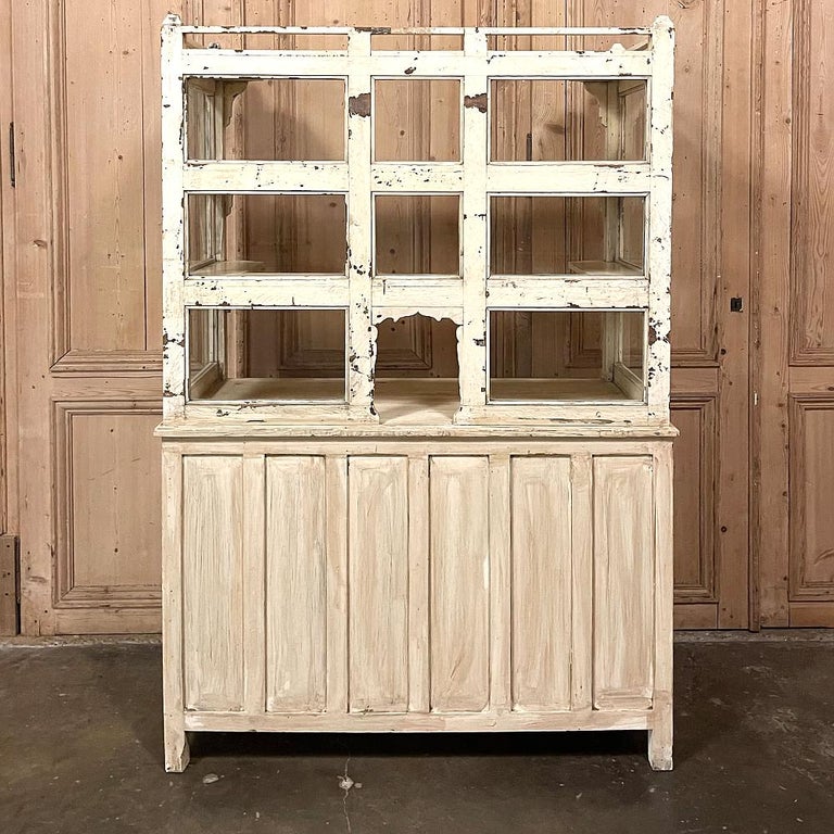 19th century painted store counter ~ display cabinet is a marvelous artifact from the Belle Epoque, and perfect for use as a dry bar or a coffee bar! Three tiers of wraparound windows feature shallow shelves behind for whimsical display, and a