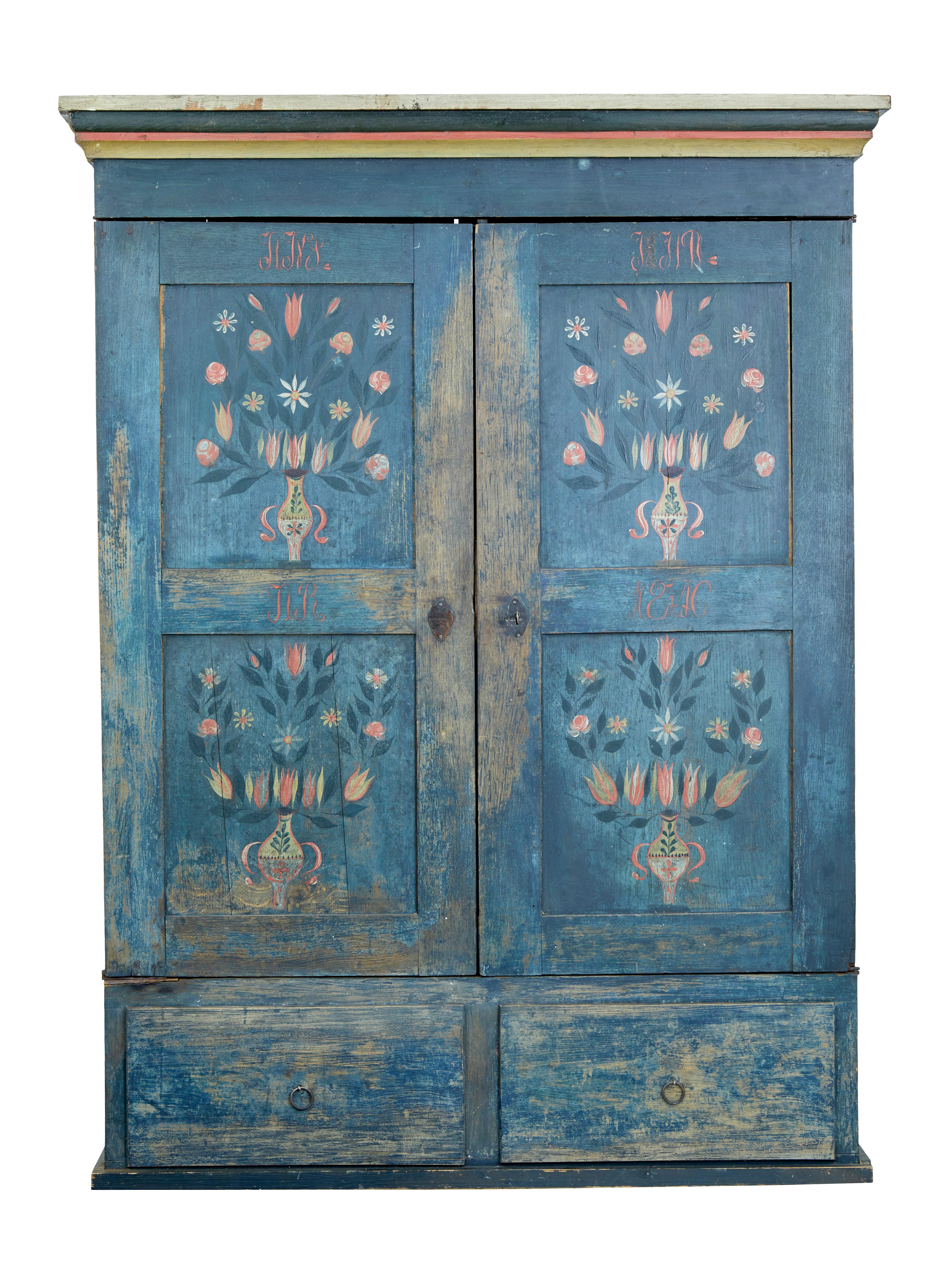 Beautiful original painted Folk Art Swedish wardrobe, circa 1850.

Presented in its original blue color scheme with hand painted flowers on each door panel.

Double doors open to a central partition with 3 shelves to the left hand side, and