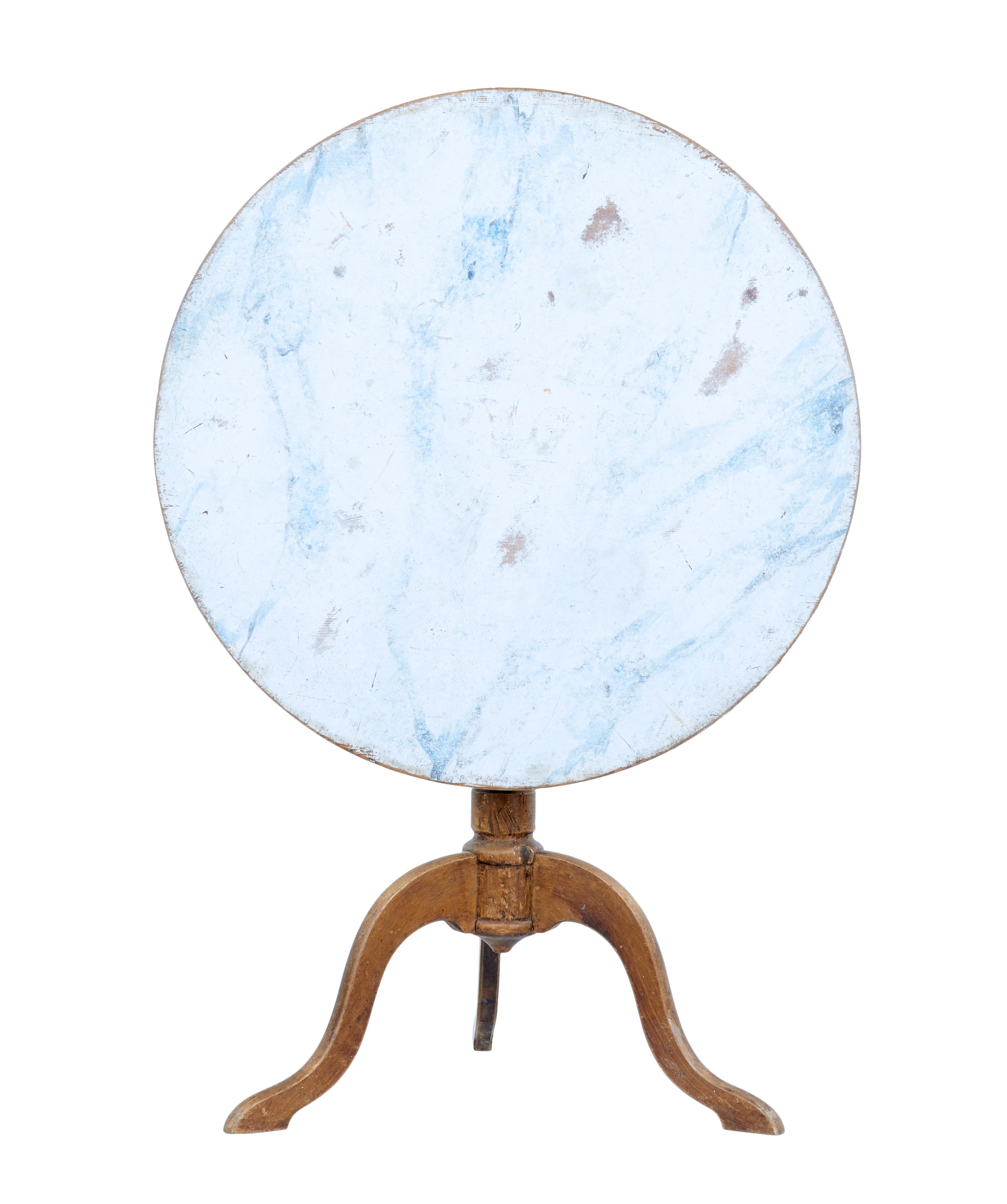 Fine rustic Swedish painted tripod table, circa 1860.

Circular top with faux hand painted marble effect, using whites and blues. Table fixes in place with peg. Standing on turned stem and 3 scrolled legs.

Base with traces of original
