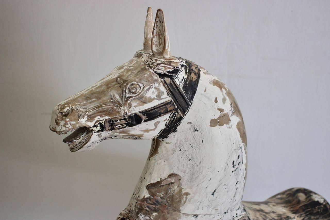 A very charming, 19th century carved and painted wooden horse from Sweden, with great proportions that will make a statement in most settings. (distressed paint of a later date).