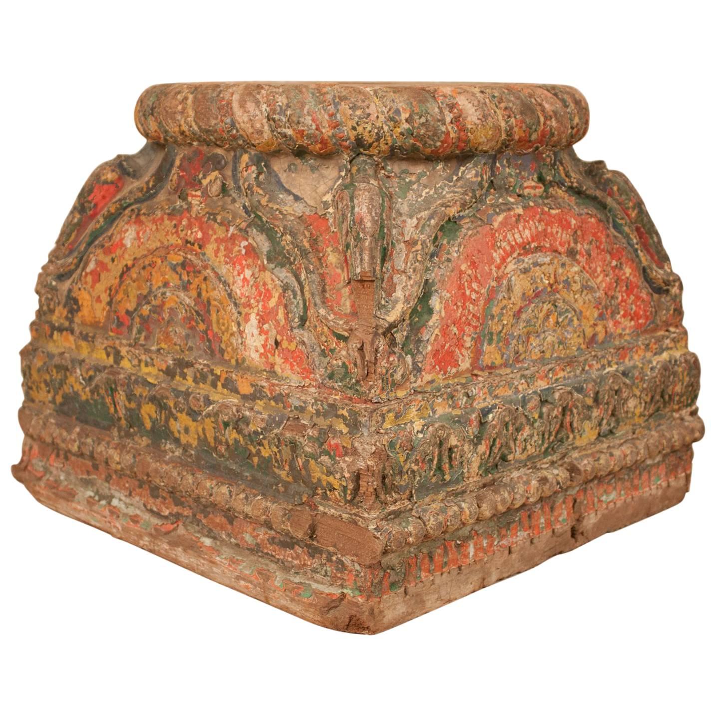 A set of three 19th century column supports that most likely graced the courtyard of a haveli or mansion in Gujarat, India. These exceptional circa 1830 bases are carved from teak wood and have many layers of old paint. Note that small repairs were