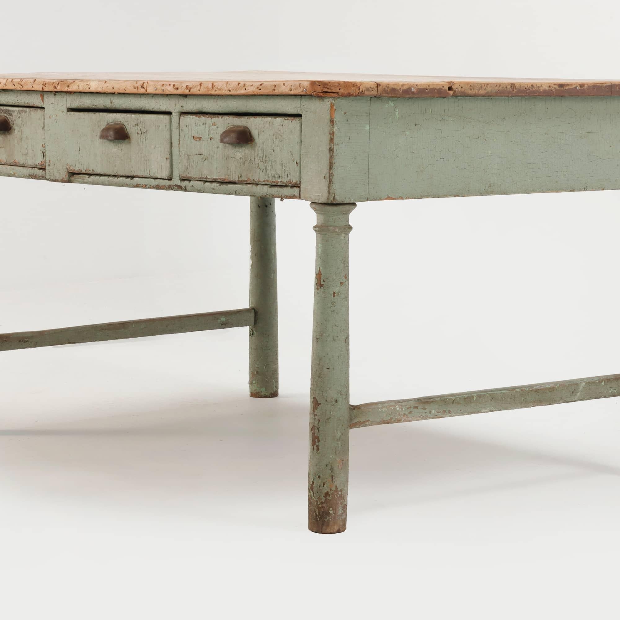 A 19th Century painted three drawer farm table having turned legs and natural top.