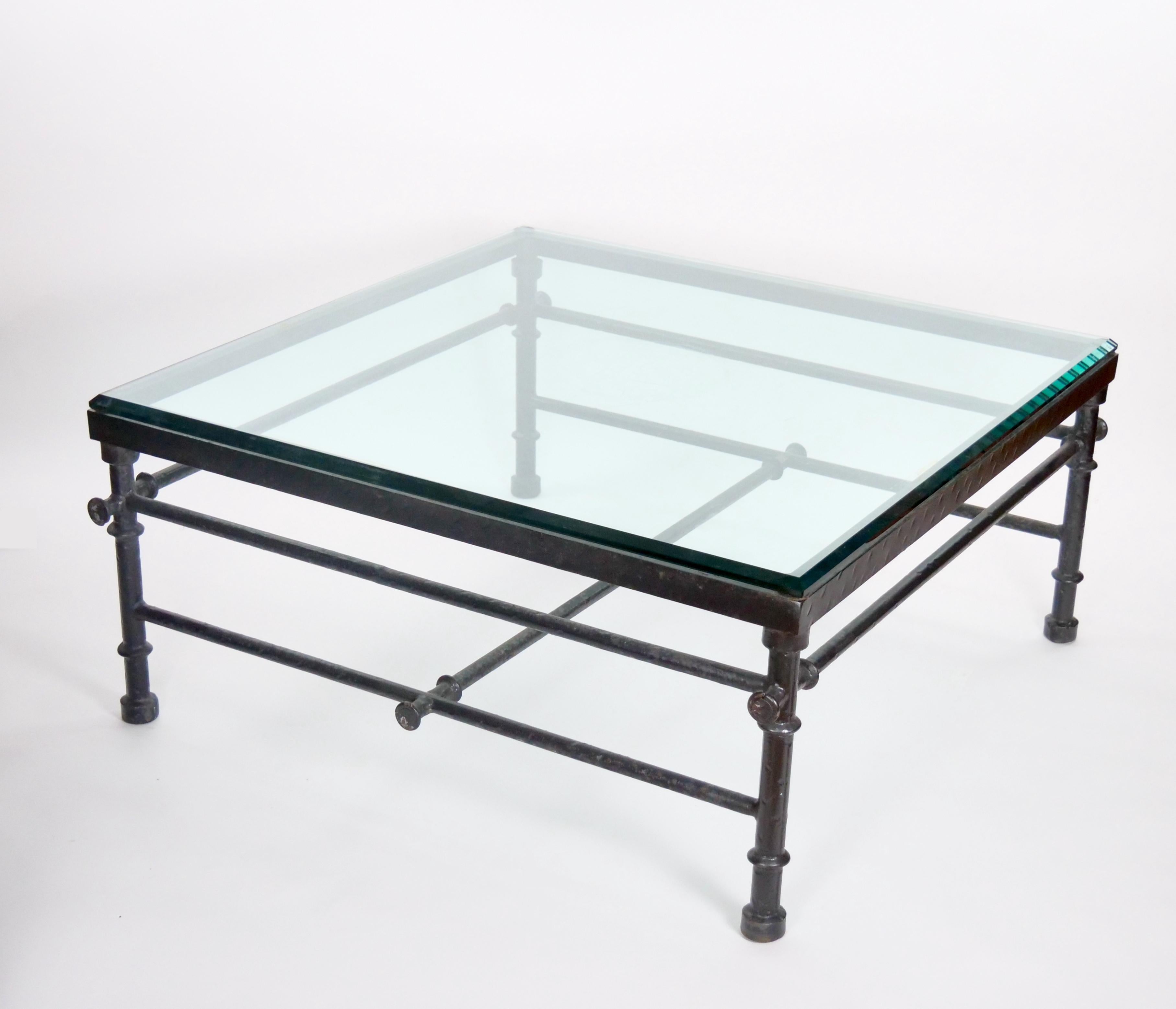 Presenting a captivating 19th Century coffee table, featuring a substantial hand-painted wrought iron frame with an inset glass top. This unique piece exudes timeless elegance, showcasing intricate craftsmanship and enduring design from a bygone