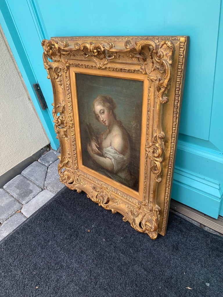 19th Century Painting of Woman Holding Rabbit in Giltwood Frame In Good Condition In Atlanta, GA