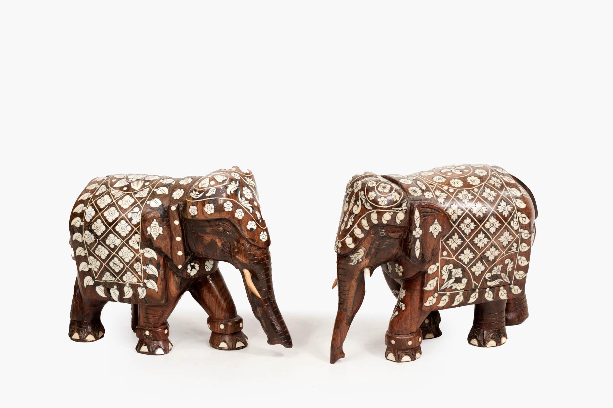 19th Century pair Anglo-Indian carved rosewood elephant statues with bone inlay. The pair are hand carved and profusely inlaid throughout with intricate bone detail.