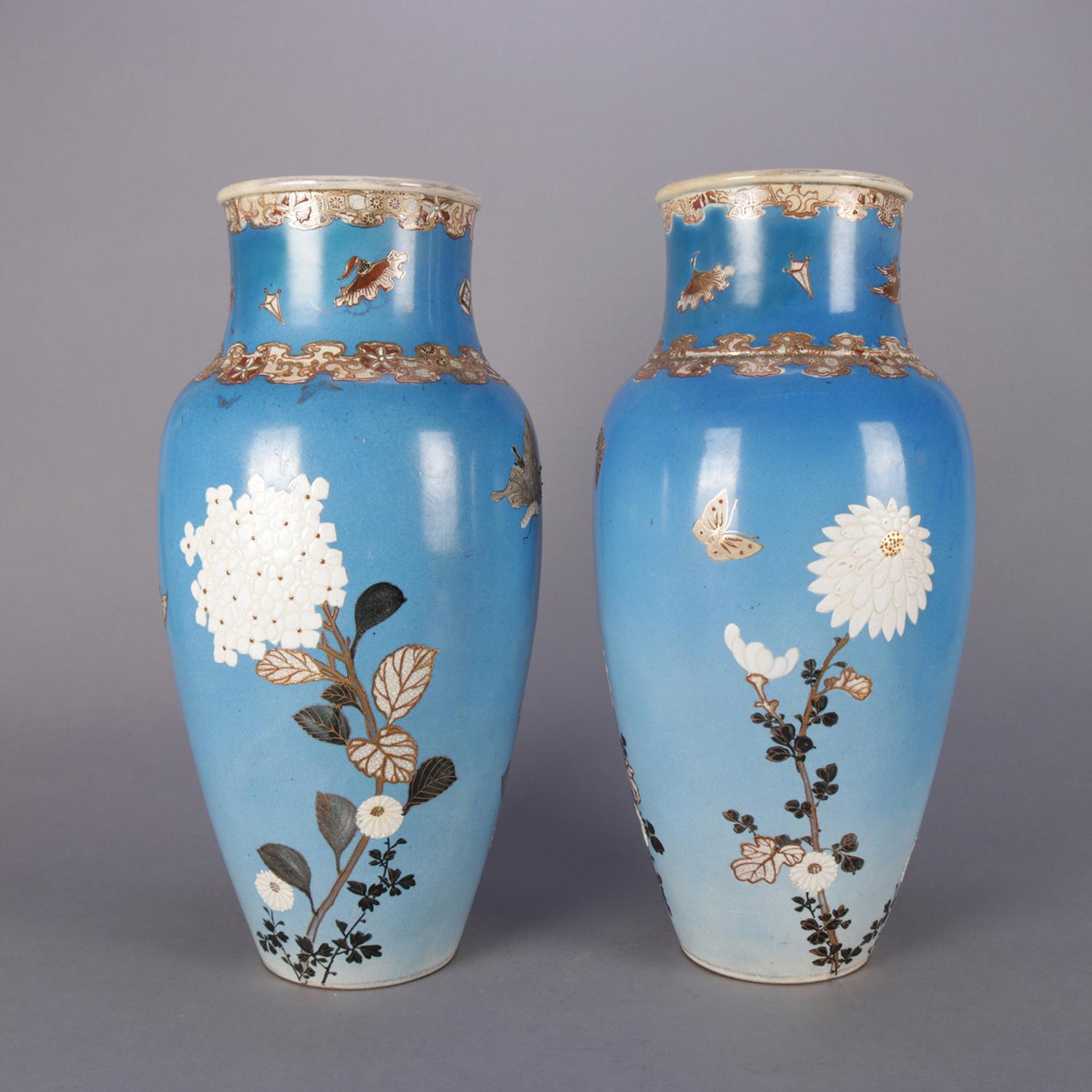 Pair of antique Japanese Satsuma arat pottery floor vases feature hand painted and gilt floral decoration on blue ground with stylized floral gilt collars, circa 1900

Measures: 19