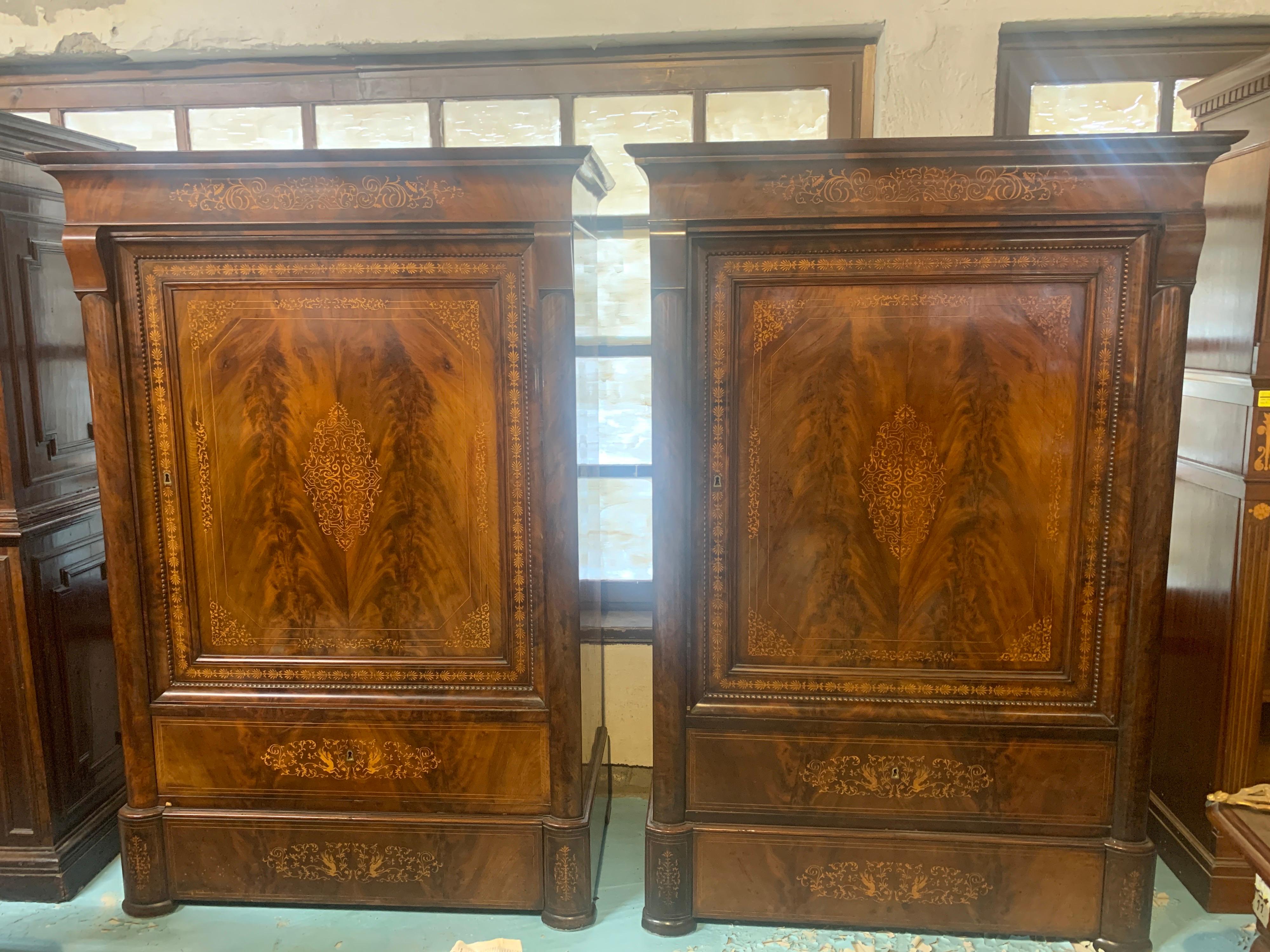 Pair of Italian wardrobes, city of Naples, Charles X period circa 1820, mahogany wood and enriched by fantastic inlaid floral motifs, are of beautiful aesthetic impact and well-proportioned, still in patina and to be restored. They are the Classic