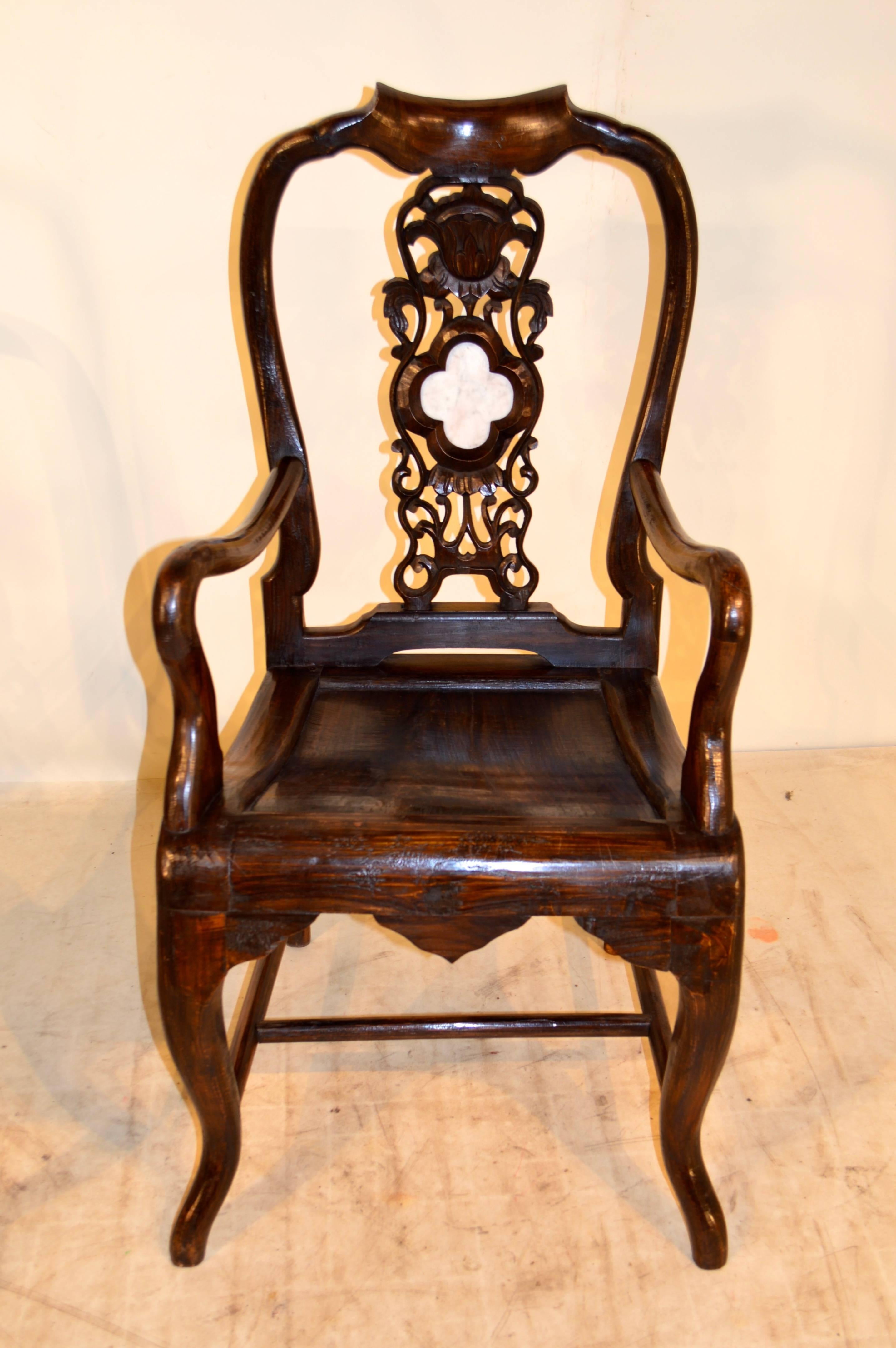 Pair of 19th century Asian teak armchairs with pierced back supports with marble inserts. Measures: Seats 18.5” H.