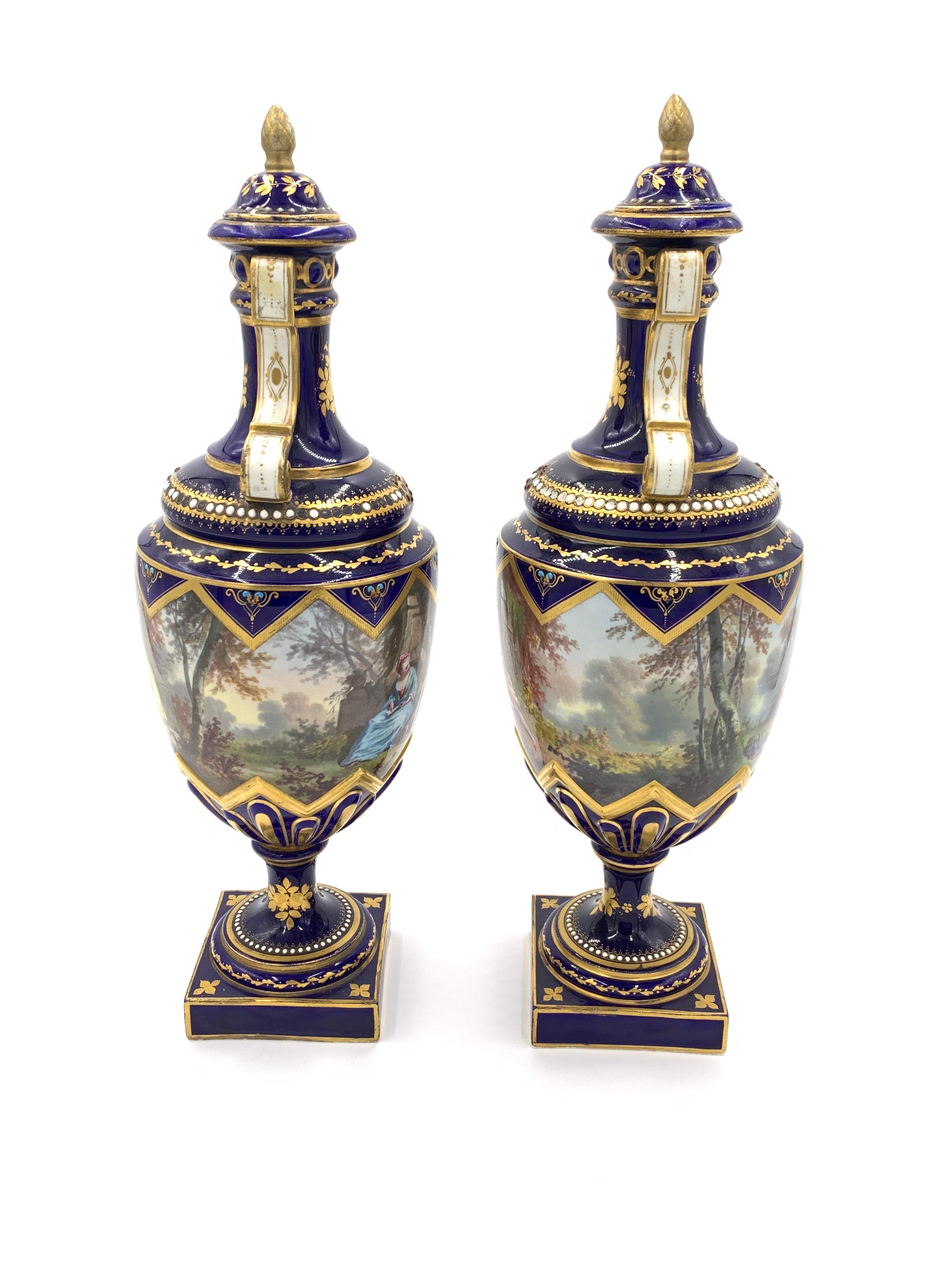Fine 19th century blue sevres style vases with paintings all around the ovoid body, gold inlaid all around the vases with semi precious stones.
  