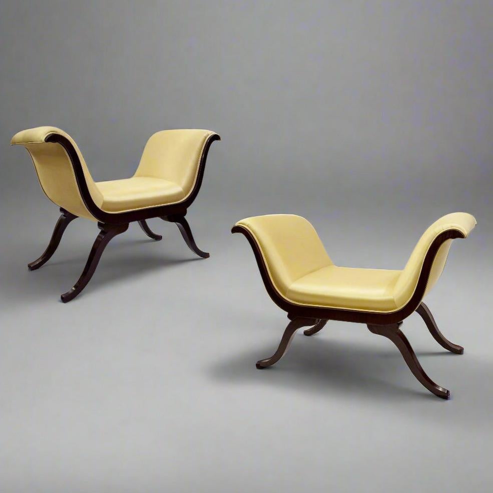 A fine pair of Belle Epoque period hardwood benches from France circa 1890. The luscious curved silhouette is visible from all sides and give these benches their desirable appeal as places to be seated at any time.