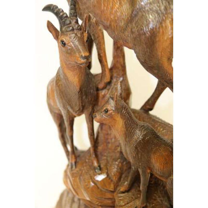 A Pair of Black Forest Carved Figures in the form of Ibex and Chamois

This late 19th century Black Forest pair of finely carved linden wood figure groups depict two family groups of Ibex and Chamois each with a male and female with their