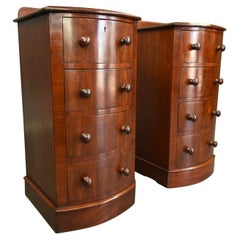 19th century pair of bow front bedside chests of drawers