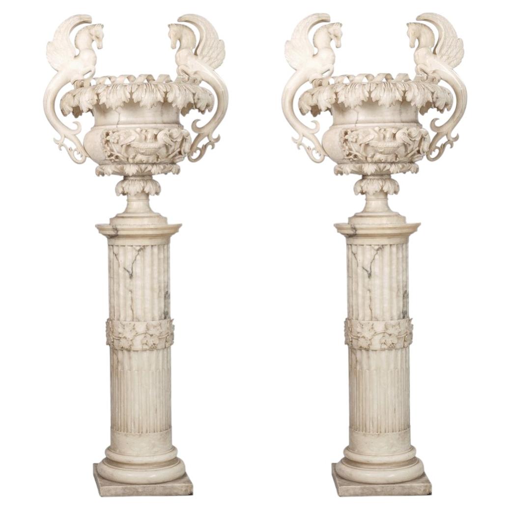 19th century pair of carved alabaster urns on pedestals