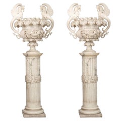 19th century pair of carved alabaster urns on pedestals