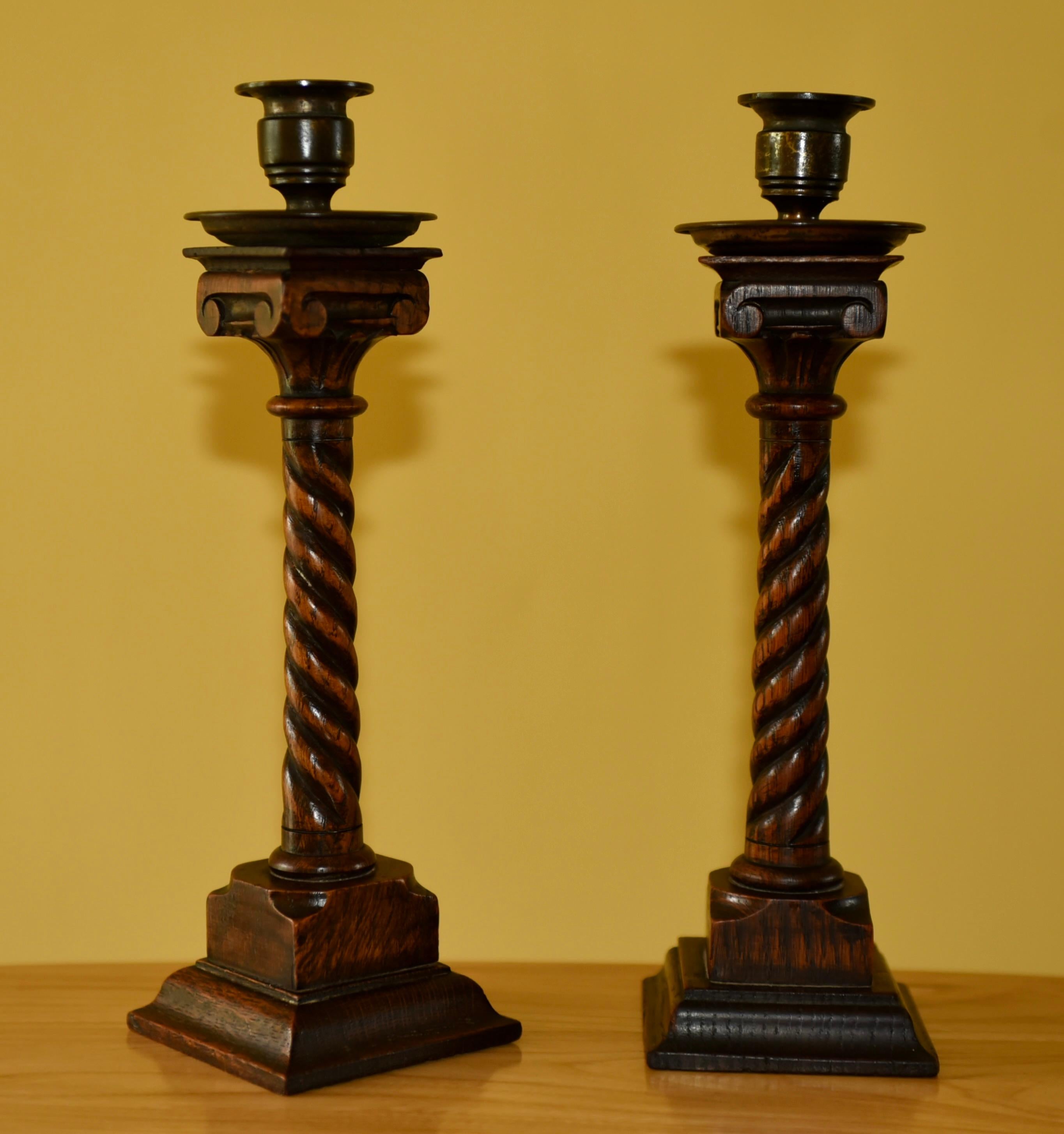 English 19th century pair of carved oak candle sticks For Sale