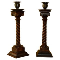 19th century pair of carved oak candle sticks