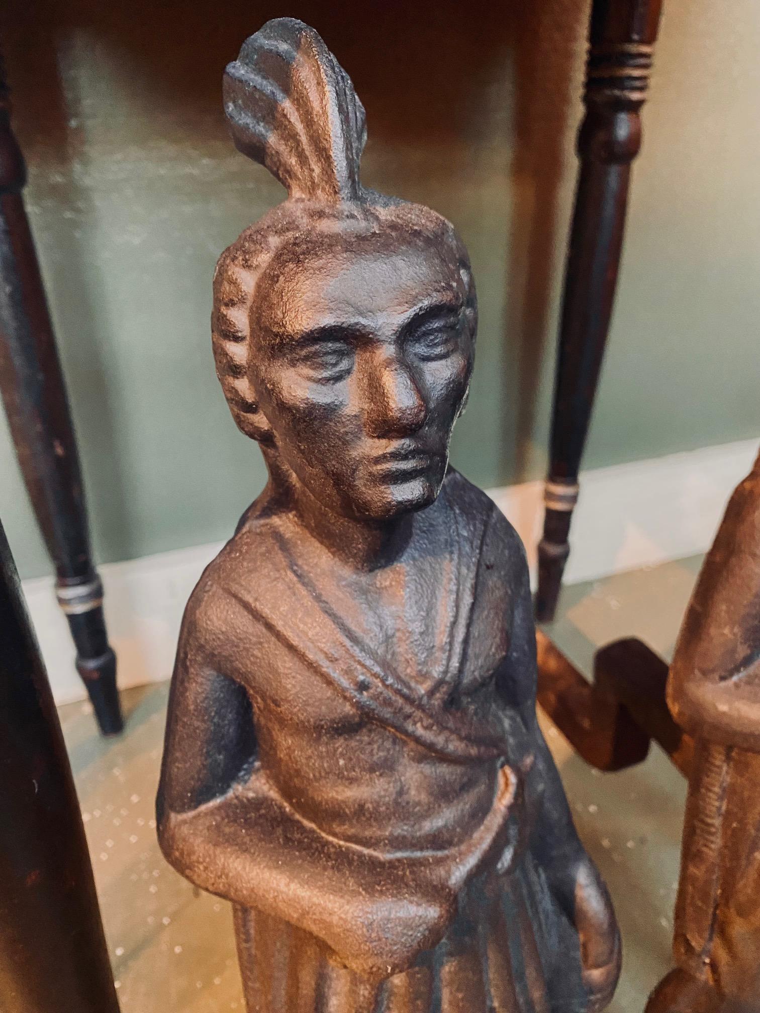 19th Century Pair of Cast Iron Native American Andirons, circa 1880, very scarce andirons depicting Massasoit, the Sachem of the Wampanoag Confederacy, who met and befriended the Pilgrims of the Plymouth Plantation. The figure is shown wearing a
