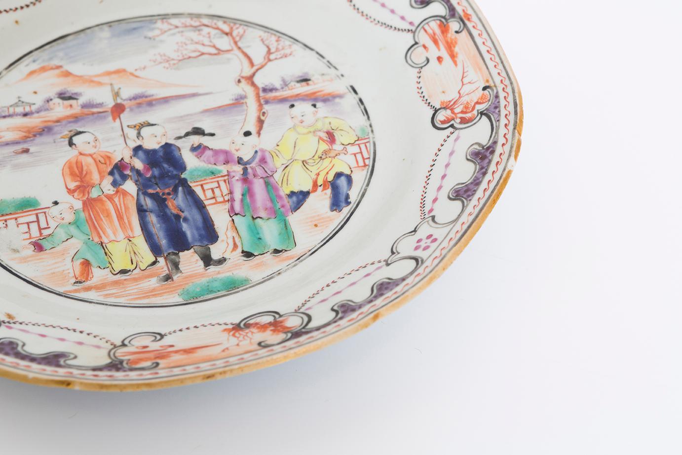 Pair of 19th century export plates with figures and a scallop design around the edge in multi colors.