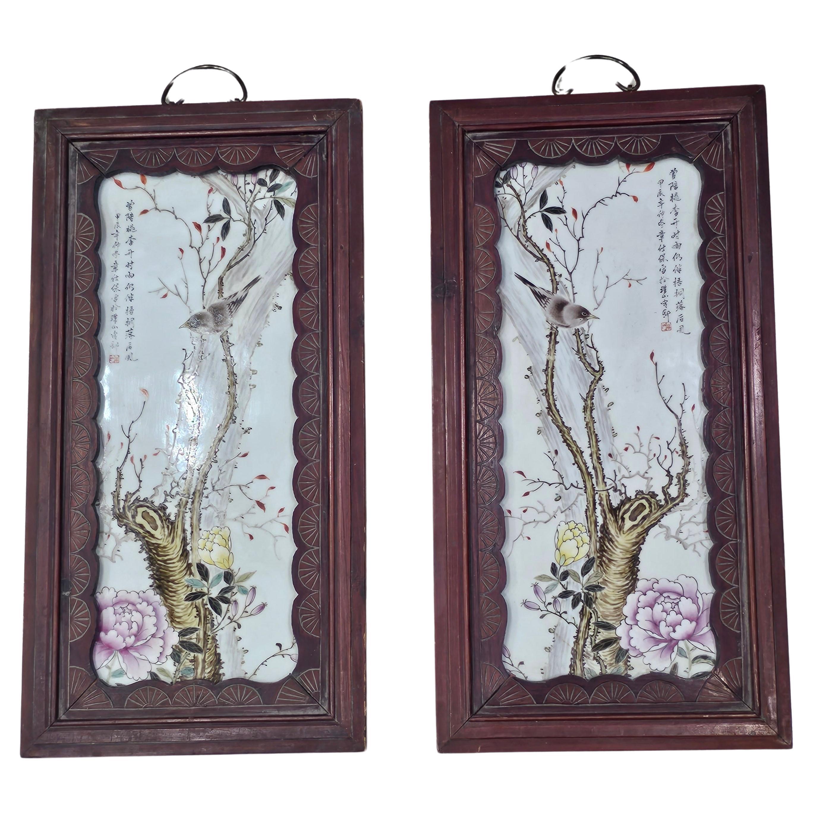 A are pair of 19th Century  Chinese Famille Rose Porcelain Plaques in Carved Wood Frames.
Measures 12.5