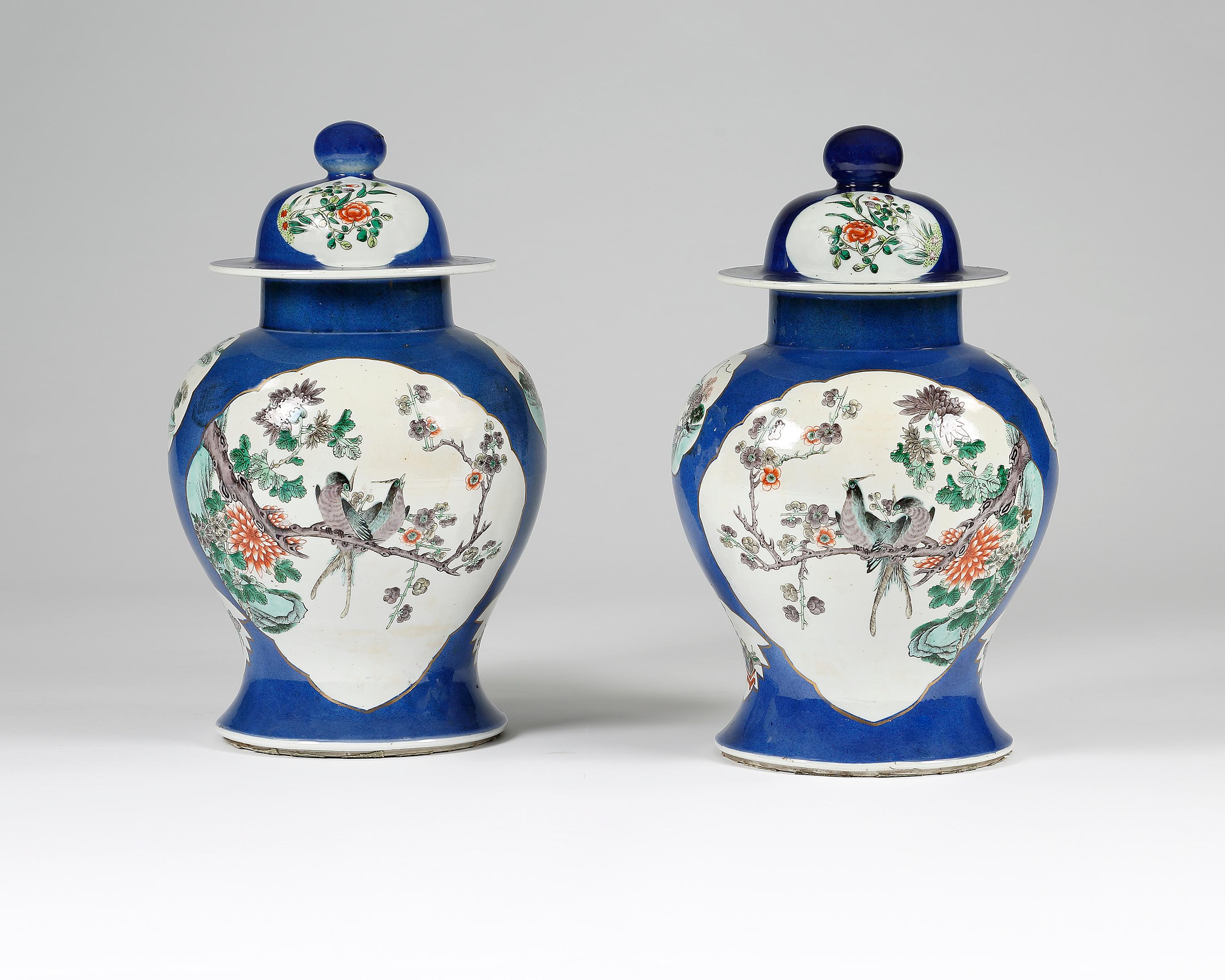 A superb pair of porcelain baluster shaped vases with possibly later covers which have now been made into lamps. Each vase having a cartouche of birds and flowers set upon a powder blue ground. 
Chinese, Quing dynasty, circa 1870. 
