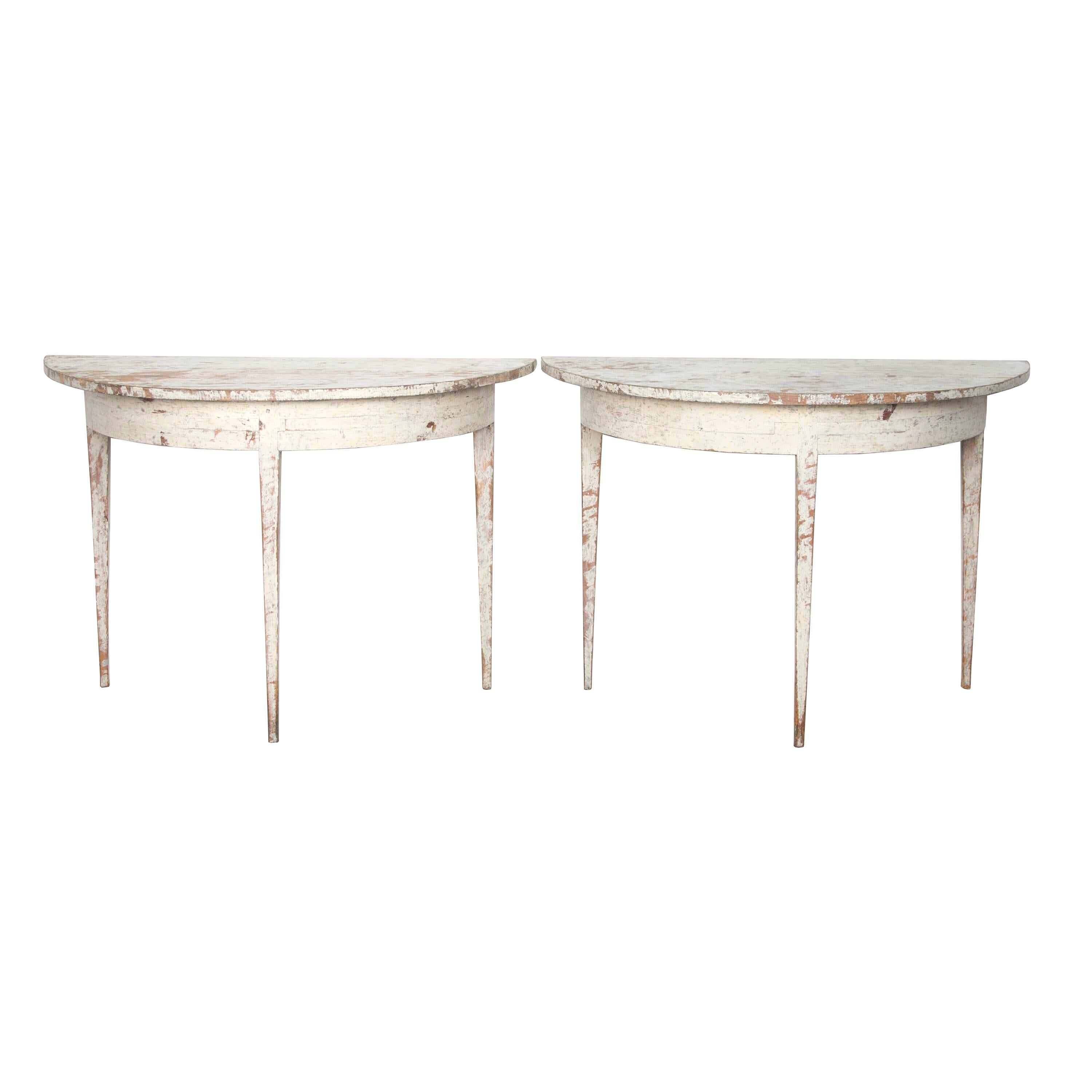 Period pair of 19th Century Demi lunes that are simple in design and style.
Scraped to original paint.