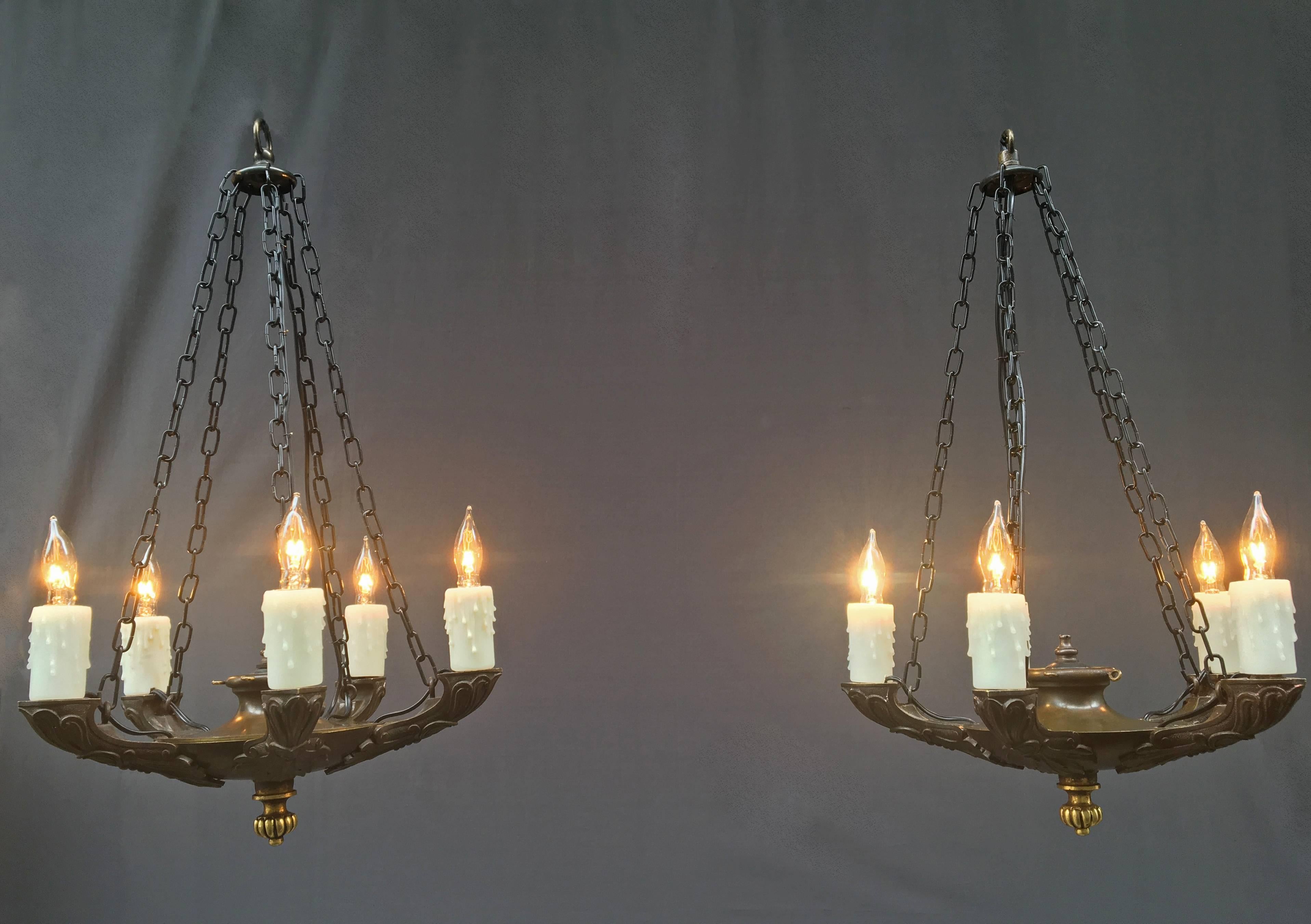 1820s pair of bronze chandeliers each containing five lights. These Grand Tour style French miniature chandeliers were originally candle and have since been rewired and electrified. Suspended by bronze chains. 

 