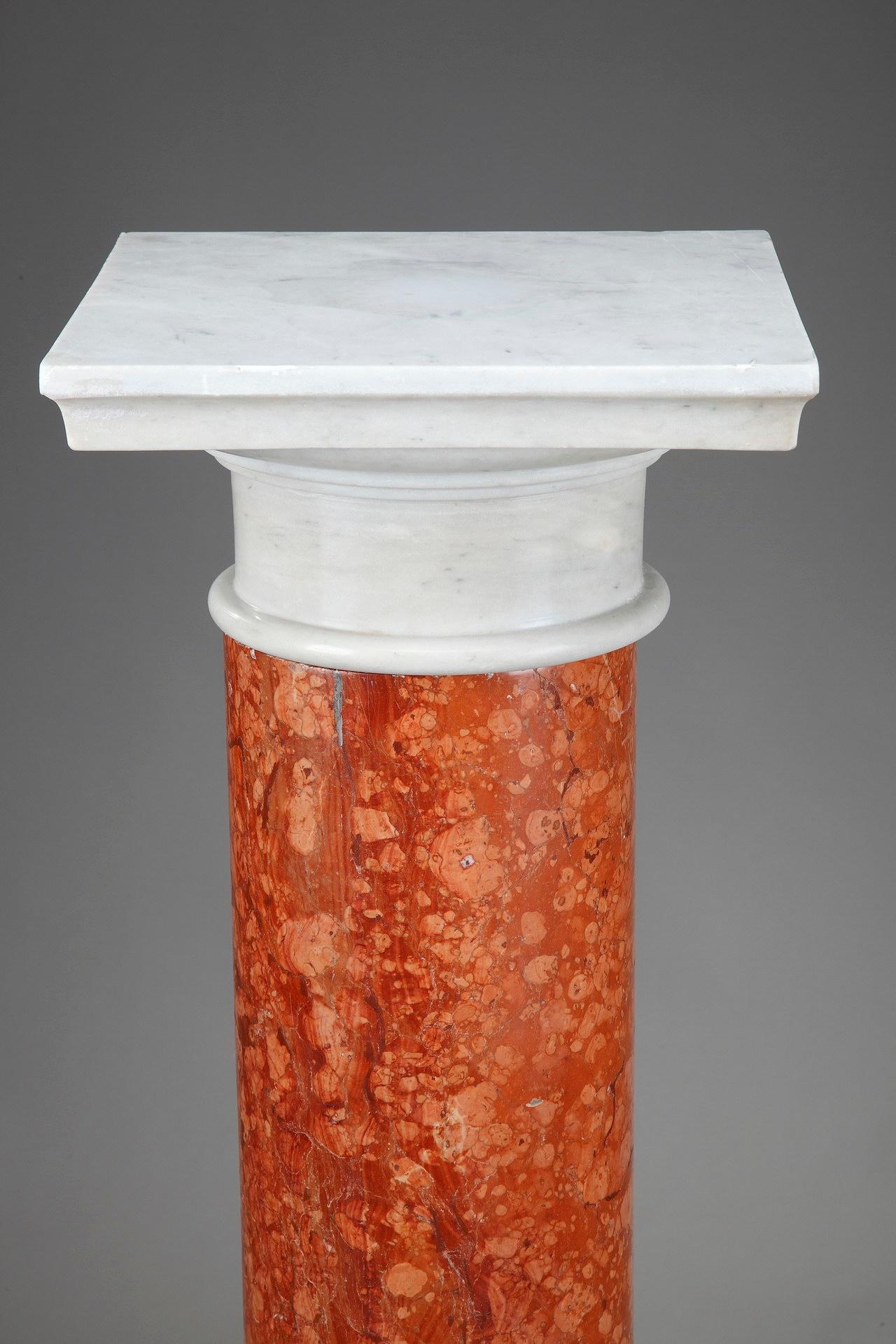 Pair of Doric columns elegantly crafted of red Italian Verona marble, with capital, plate and base in white marble. The Red Verona Marble (Rosso Verona Marmo) is a variety of limestone rock which takes its name from Verona in Northern Italy. Its