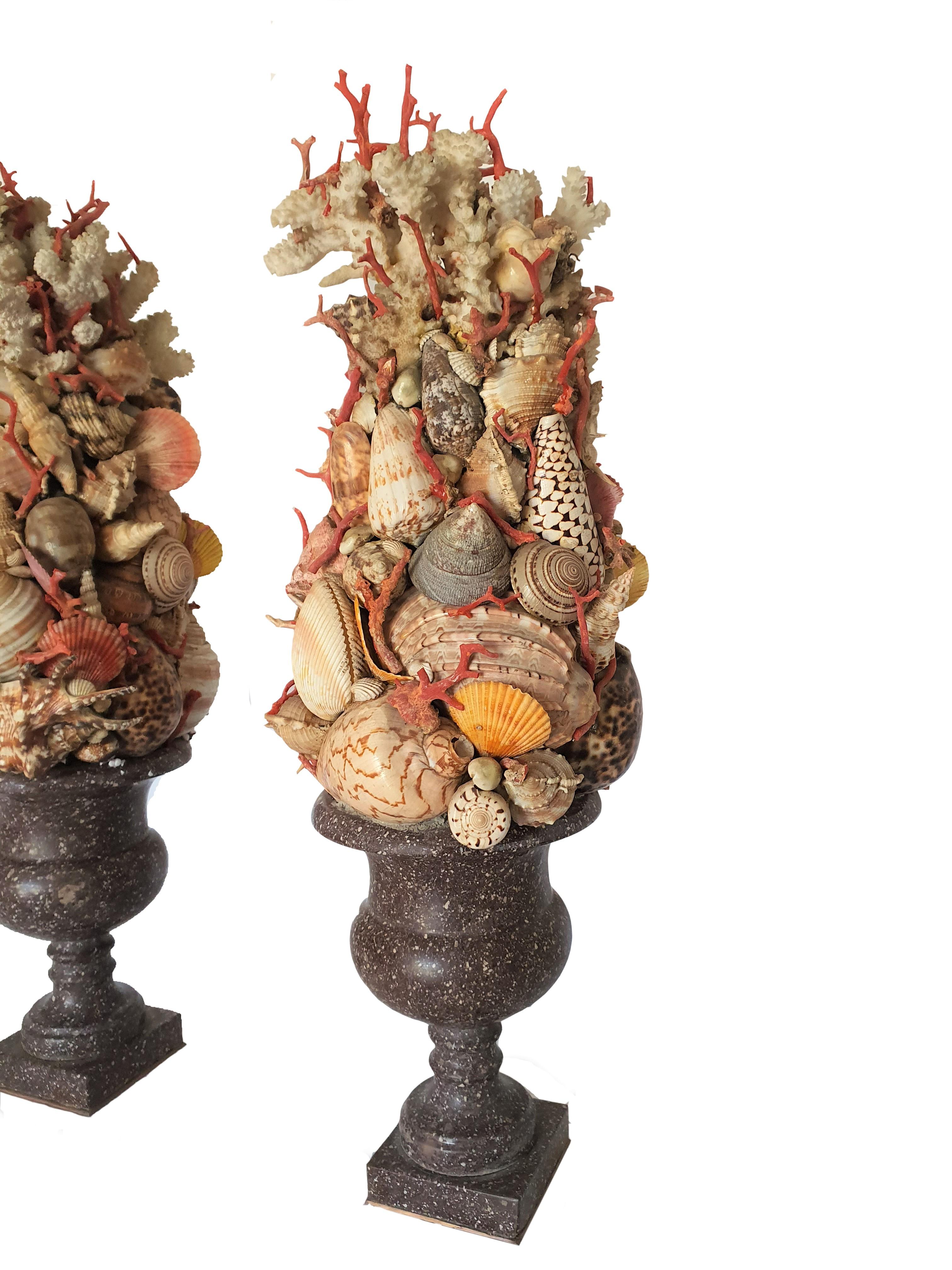 Particular pair of Egyptian porphyry vases. Seashells and applications in Trapani coral adorn the upper part of the vases.