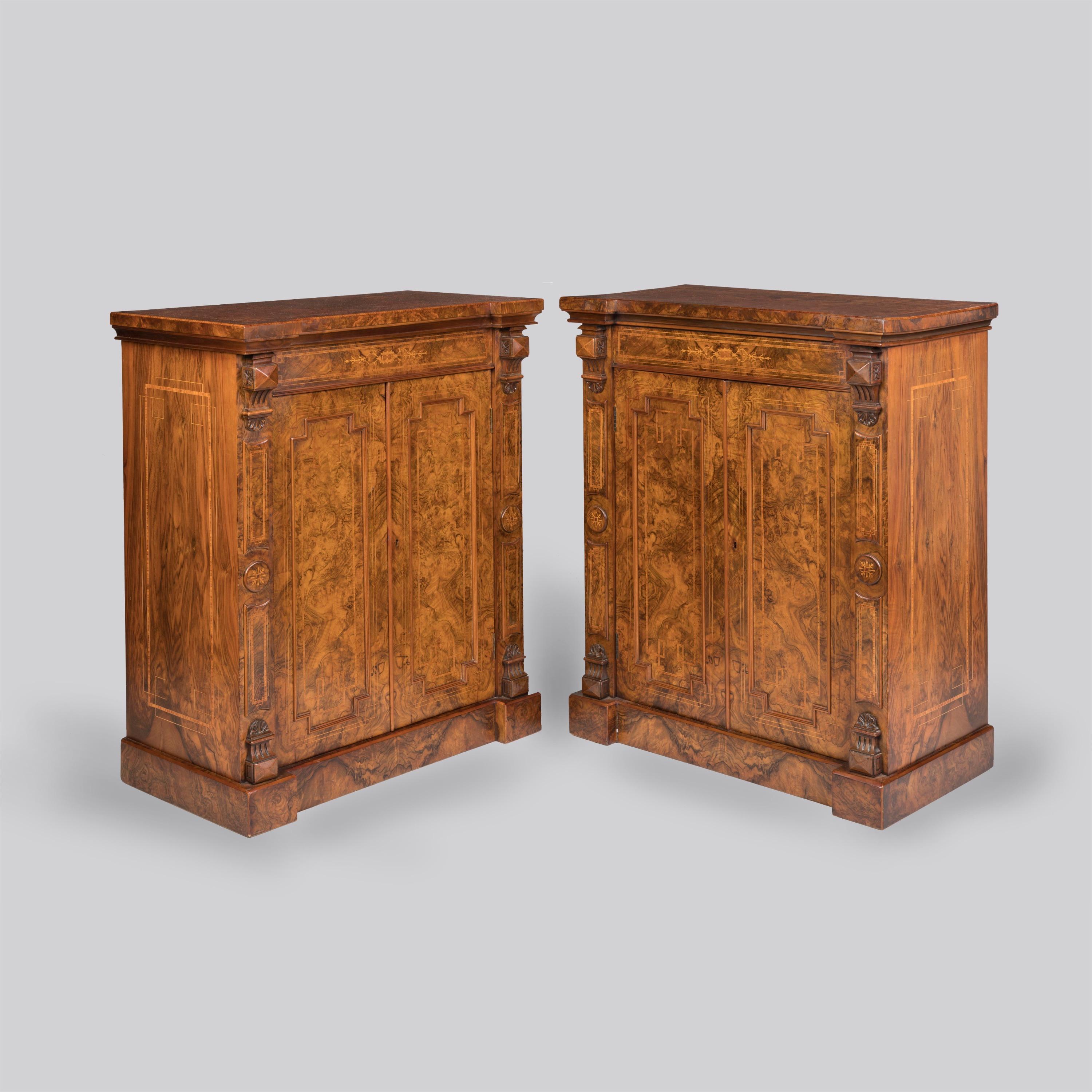 An Elegant Pair of Burr Walnut Side Cabinets

Of desirable and well-balanced proportions, the cabinets made of finely figured burr walnut with tulipwood crossbanding and boxwood stringing, each with plinth supports and pilasters to the corners with