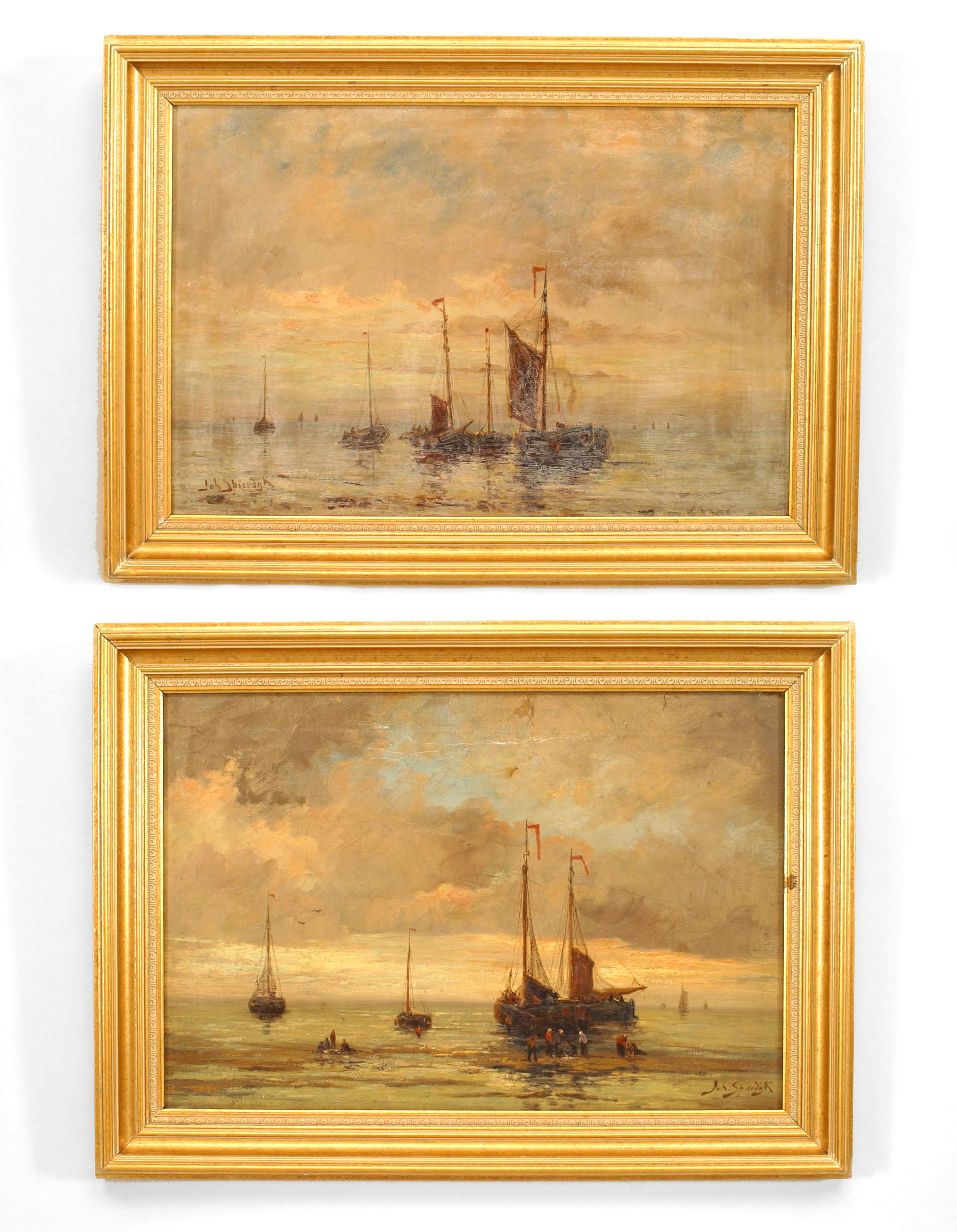 Pair of English Victorian gilt framed oil paintings of seascapes with fishing boats resting near beach. (signed) (PRICED AS PAIR).