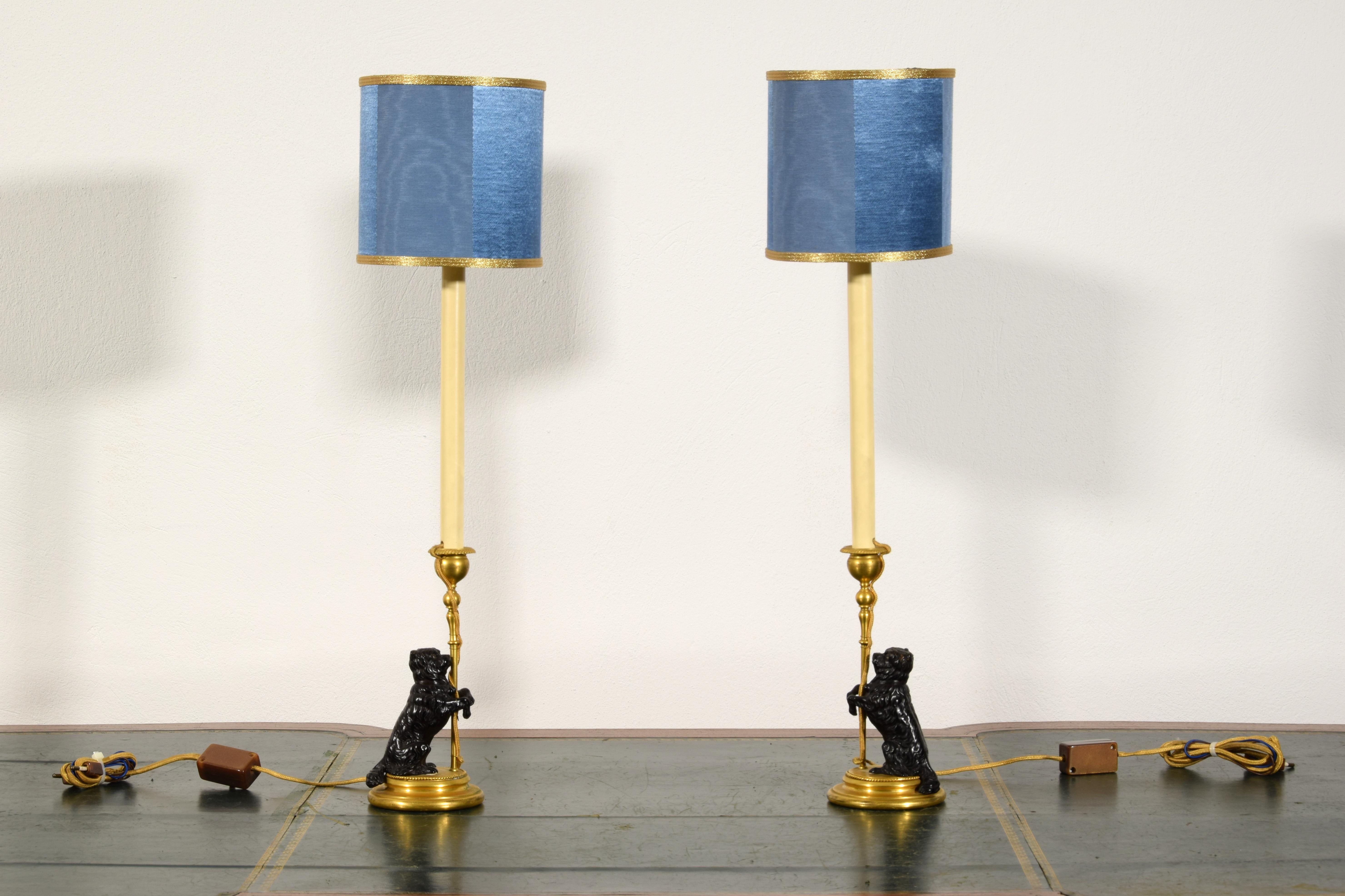 19th Century, Pair of Frech Gilt and Burnished Bronze Candlesticks with dogs

Measurements: cm H 61,5 x base diameter 10; H candlestick without lamp holder cm 21,5; lampshade diameter cm 16 x H 16

The pair of candlesticks was made of gilded bronze