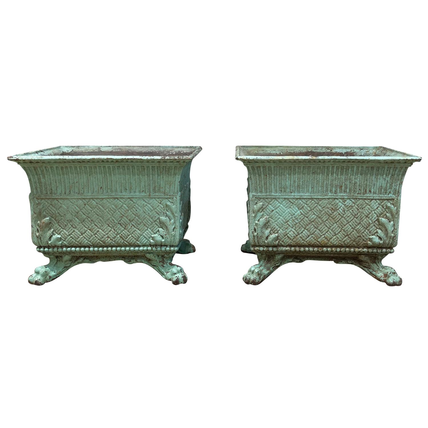 An antique pair of rectangular French cast iron planters garden planters, raised on little feet in good condition. Wear consistent with age and use. Circa 19th Century, Lyon, France.