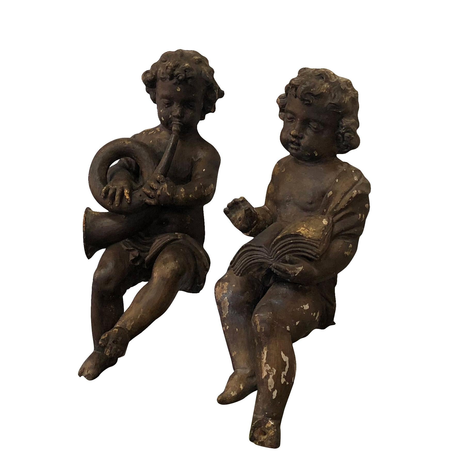 A hand carved wooden pair of French Baroque angels. The angels or “Anges” are waxed with their natural finish and were hand carved in limewood.
