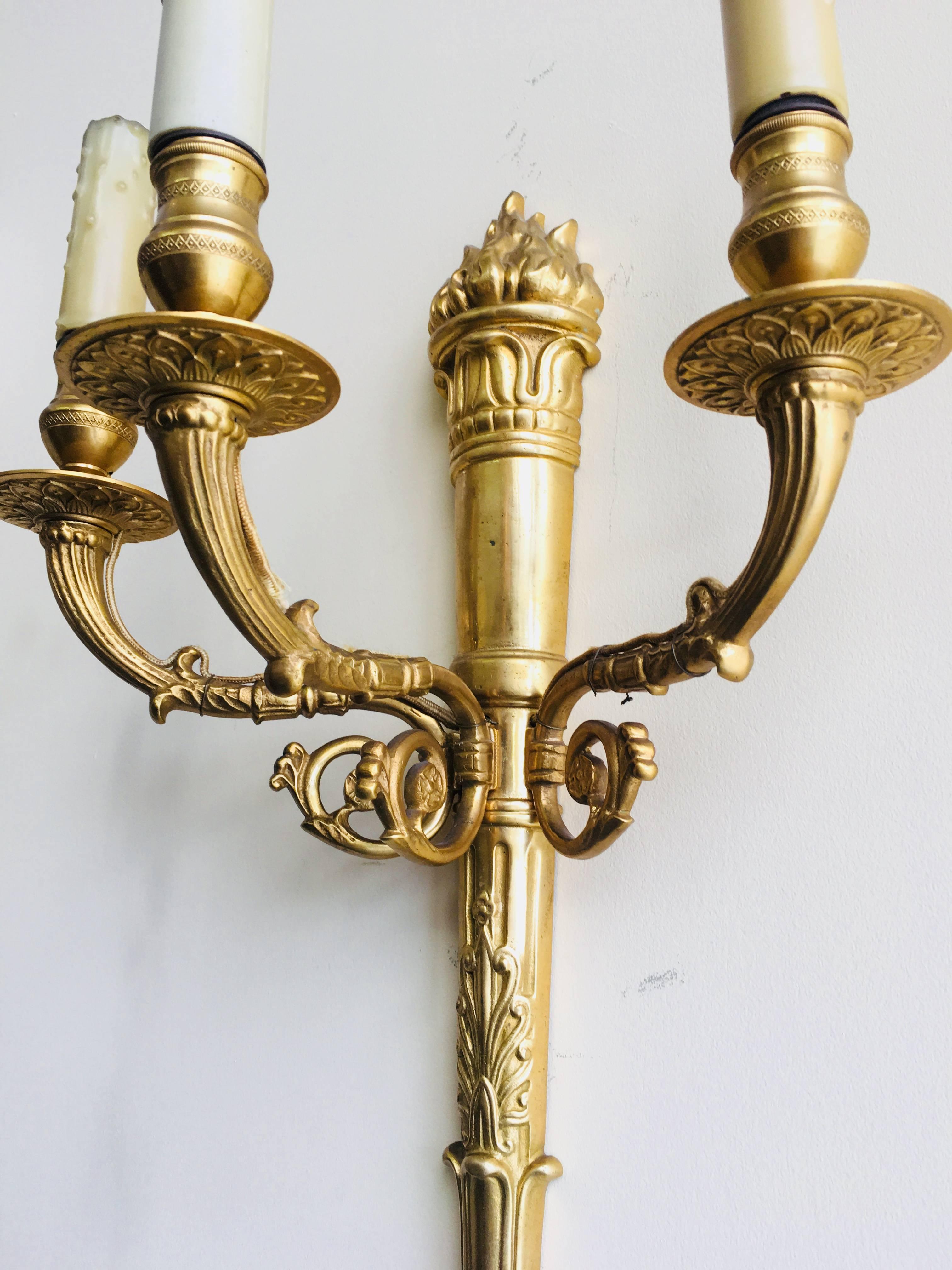 A very fine pair of French 19th Louis XVI style gilt bronze three-light wall sconces.
circa 1890, Paris.