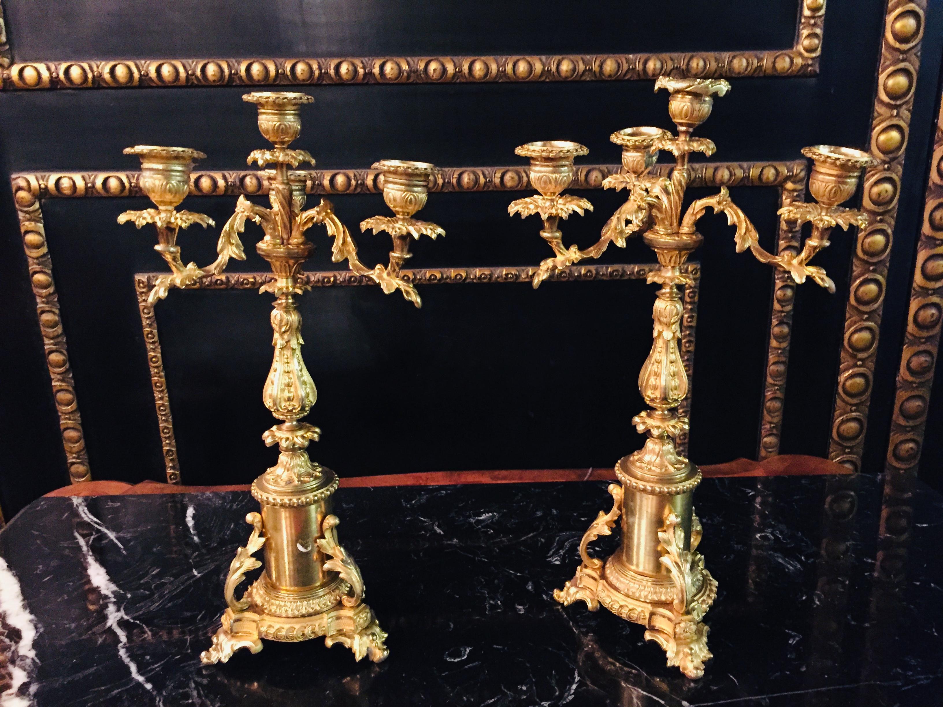 19th century pair of French candle lamps bronze
Richly carved body, solid bronze gilded. Each 4-flame arms. Extremely decorative and high quality workmanship, 19th century.