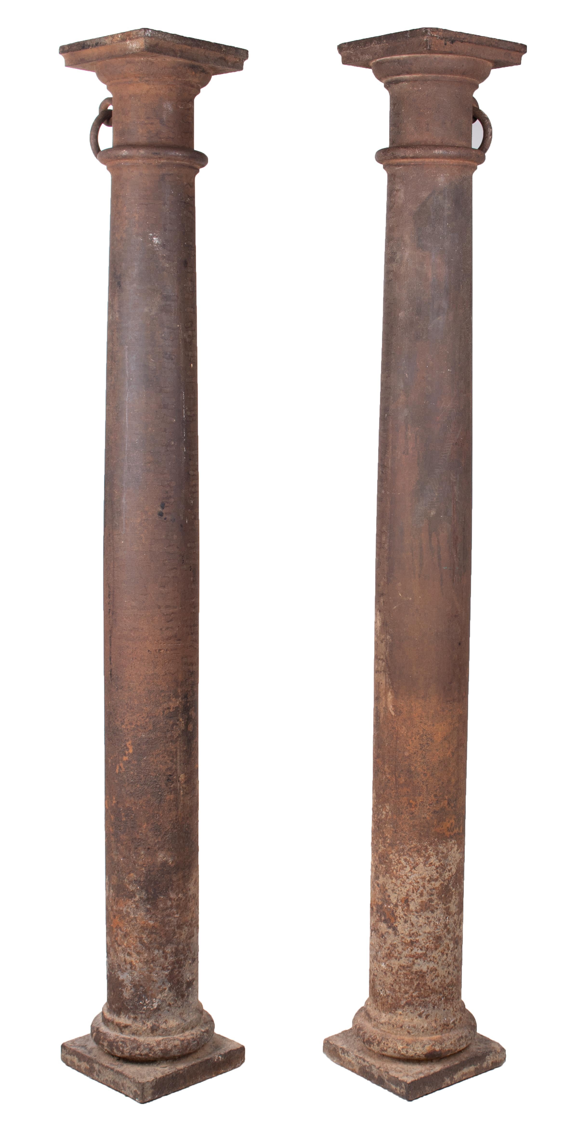 19th century pair of French cast iron columns with tie rings.