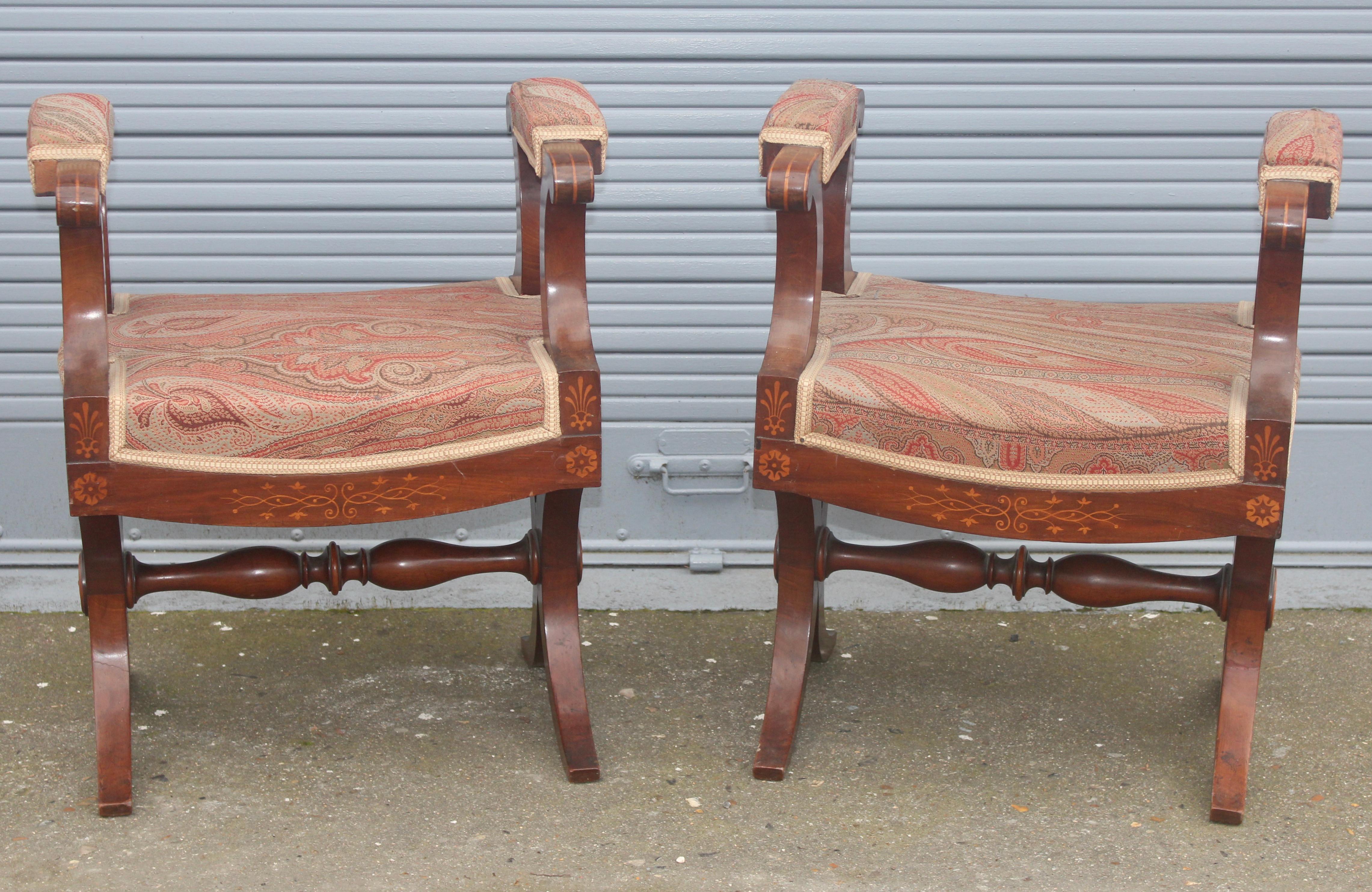 Pair of French 19th century Charles X stools with arms
Mahogany and fruitwood inlaid with neoclassical foliate scrolls, rosaces and palmettes
with upholstered arms and seat,
circa 1825.
  