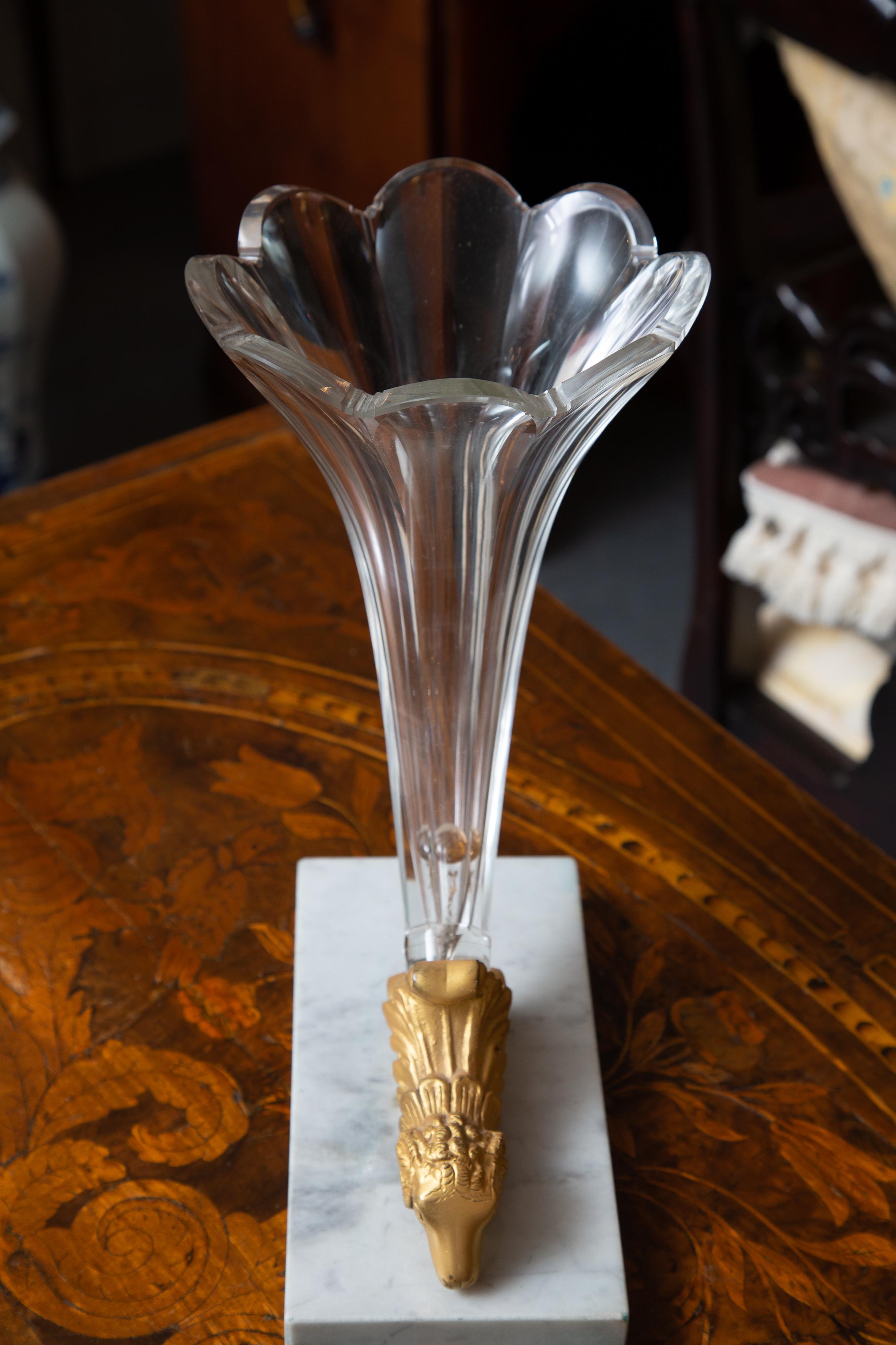 This is an elegant pair of French Empire style glass cornucopia vases, situated on white marble bases, 19th century.