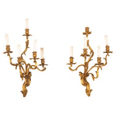 19ème siècle, Paire de lampes à quatre lumières en bronze doré.
