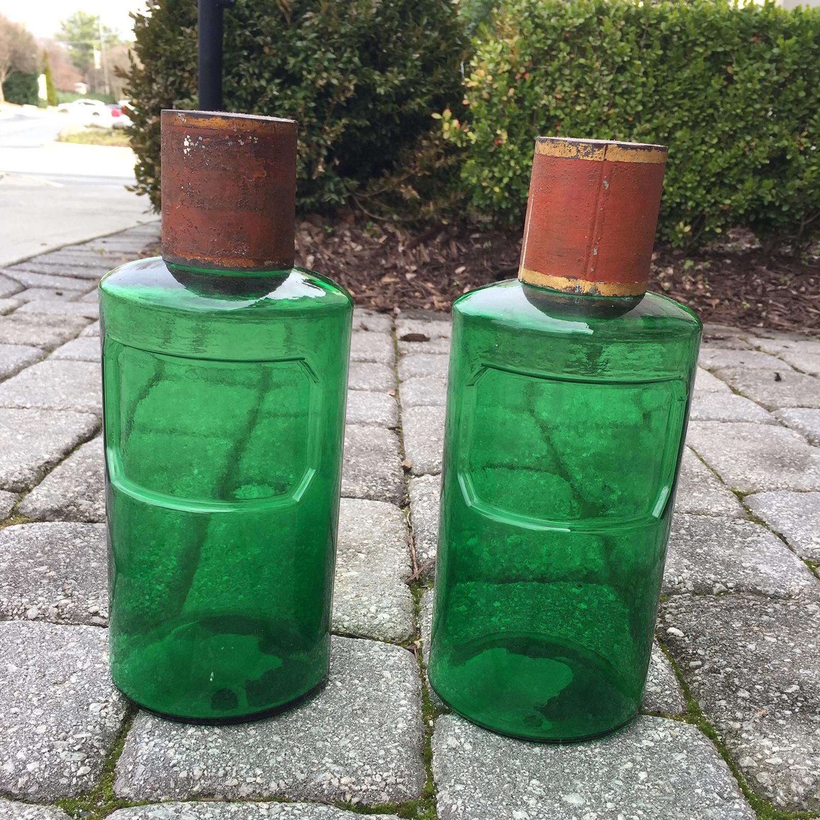 19th century pair of French hand blown green glass apothecary jars, tole lids.