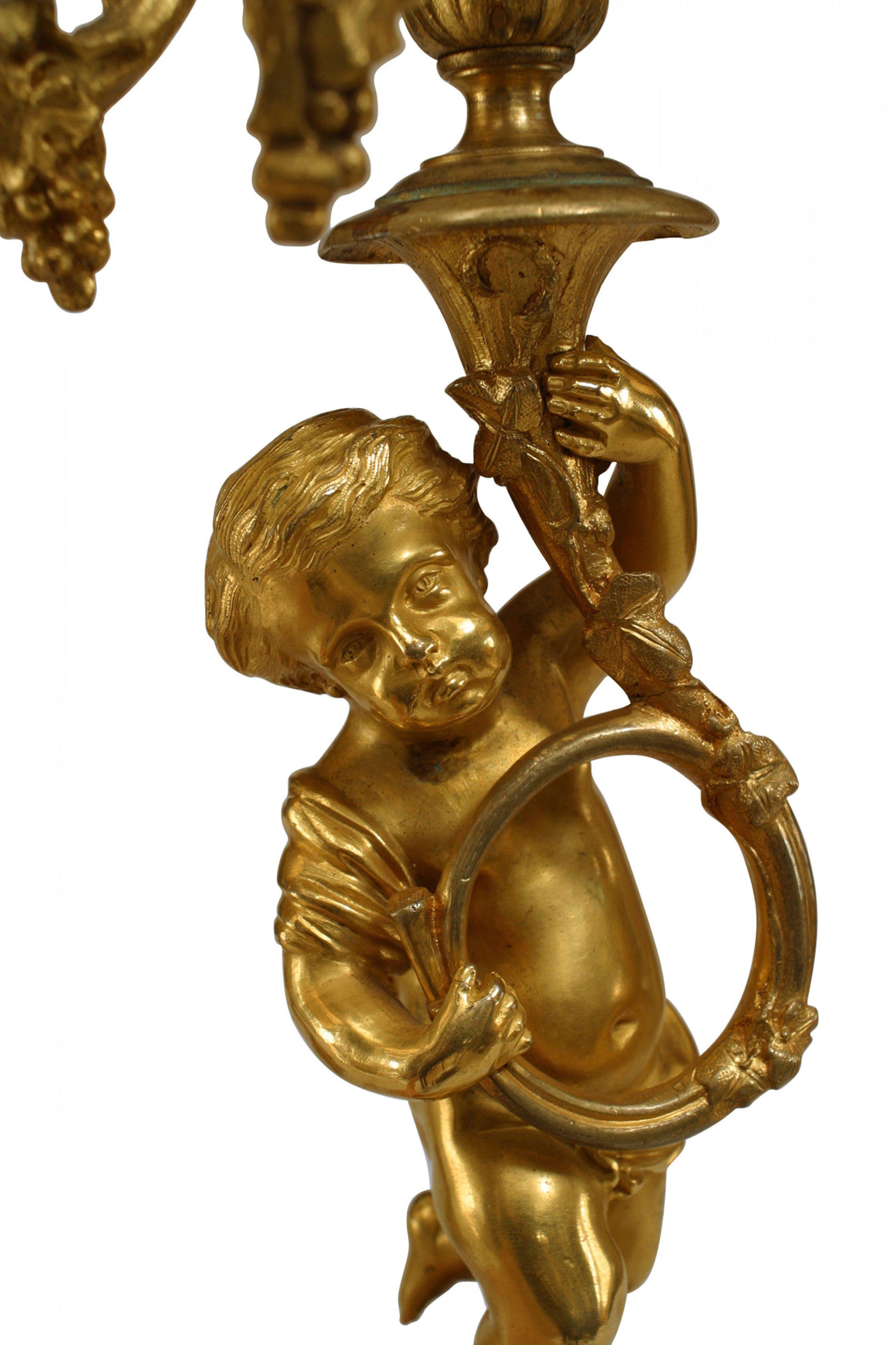 PAIR of French Louis XV-style (19th Century) bronze dore 5 arm candelabras with cupids playing horn instruments (PRICED AS PAIR)
 